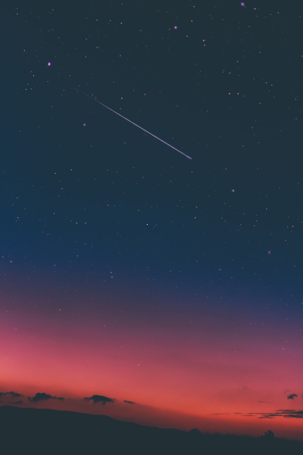 shooting star in night sky photo