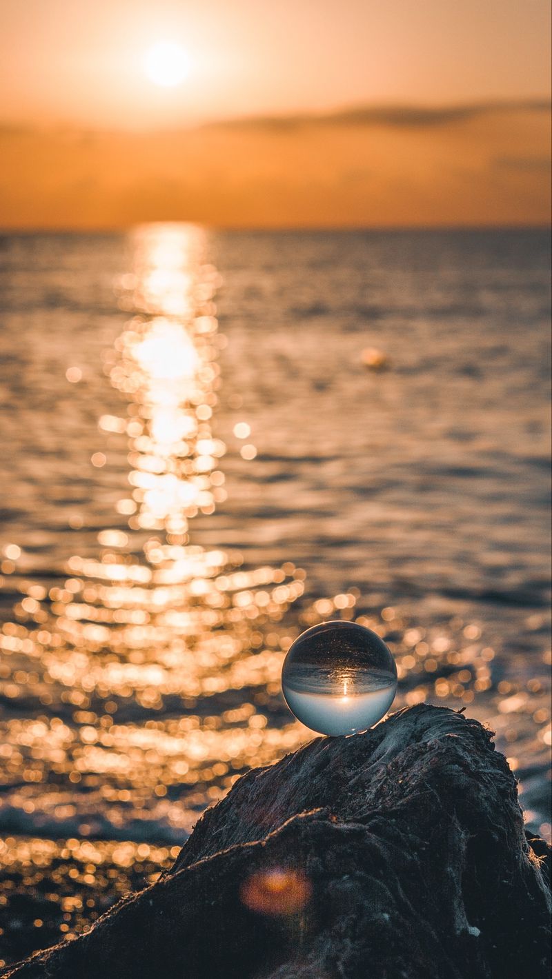 Download Wallpaper 800x1420 Ball, Glass, Glare, Sea, Sunset Iphone Se 5s 5c 5 For Parallax HD Background
