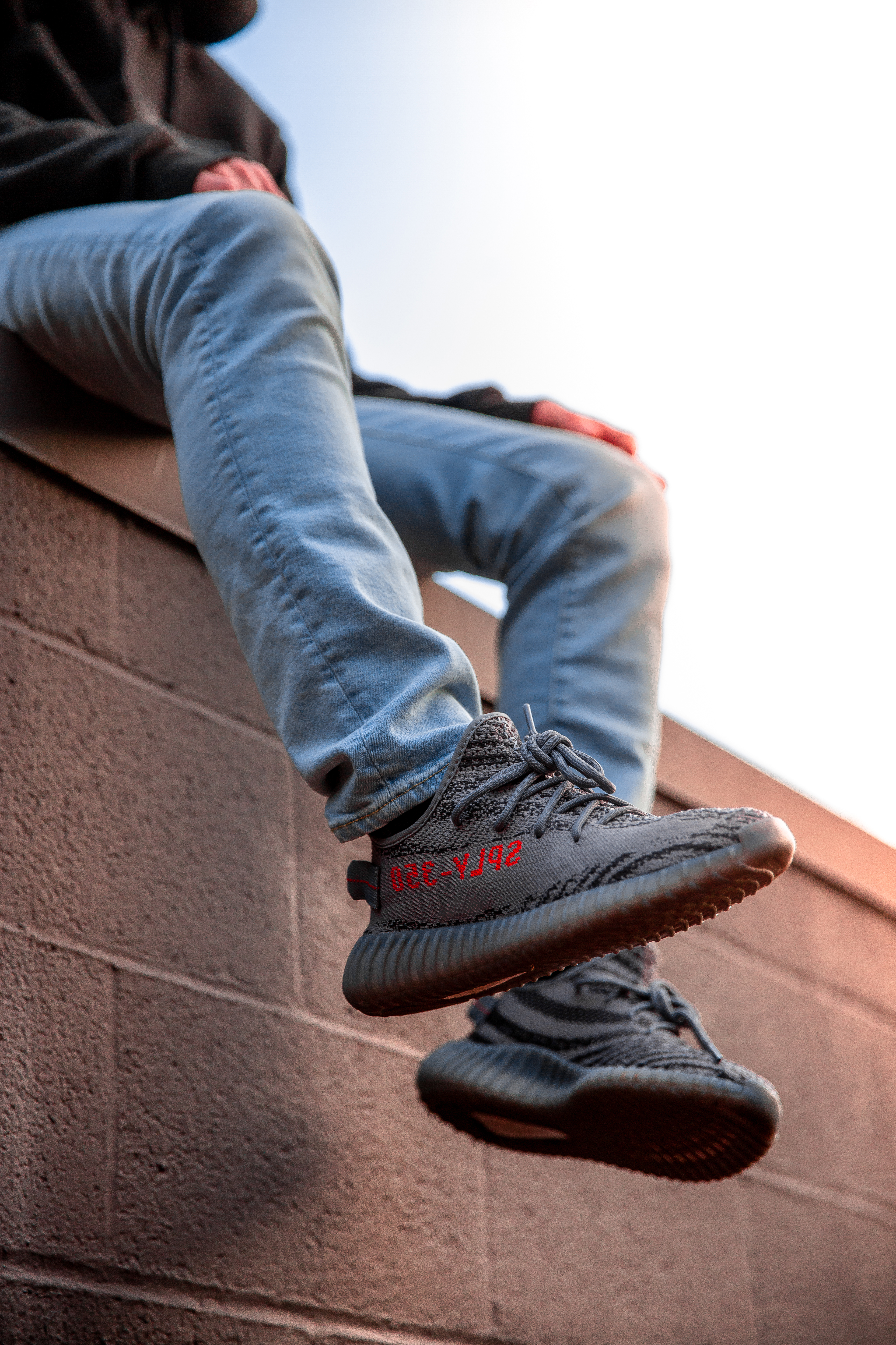 Person Wearing Adidas Yeezy Boost Shoes · Free