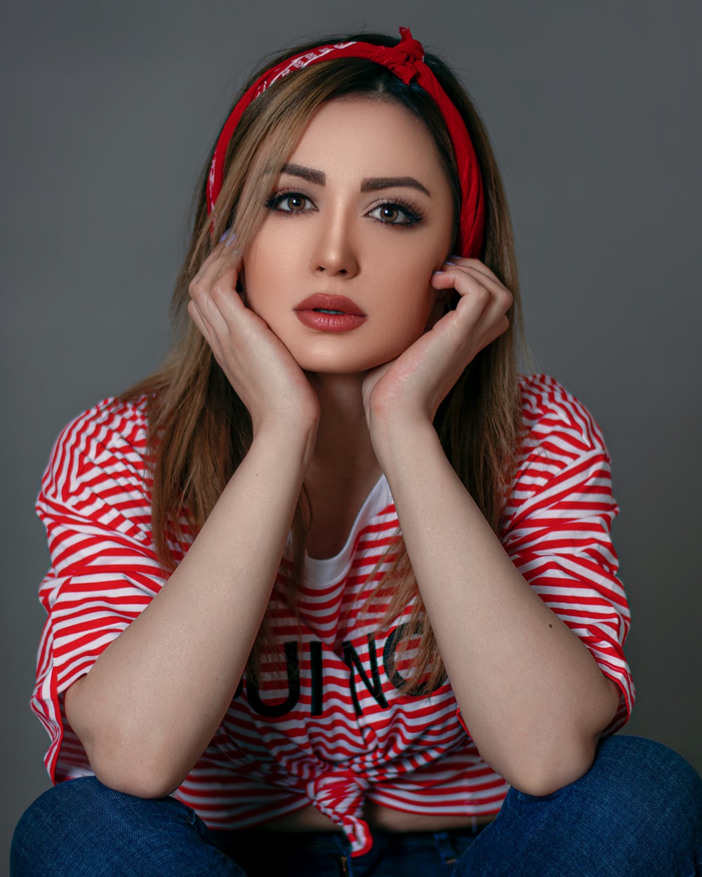 woman in red and white striped long sleeve shirt photo