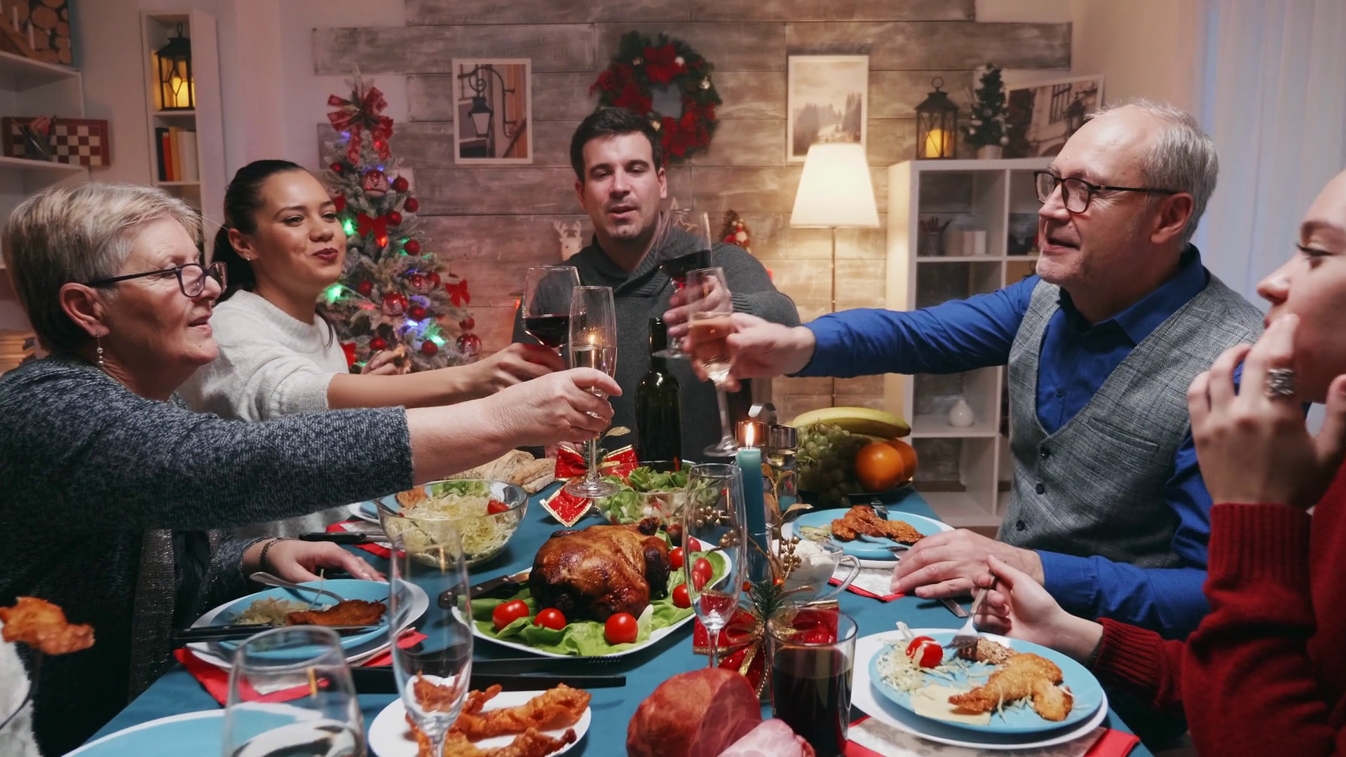 Christmas eve celebration of a big family with traditional food. Winter holidays celebration. Traditional festive christmas dinner in multigenerational family. Enjoying xmas meal feast in decorated Stock Video Footage