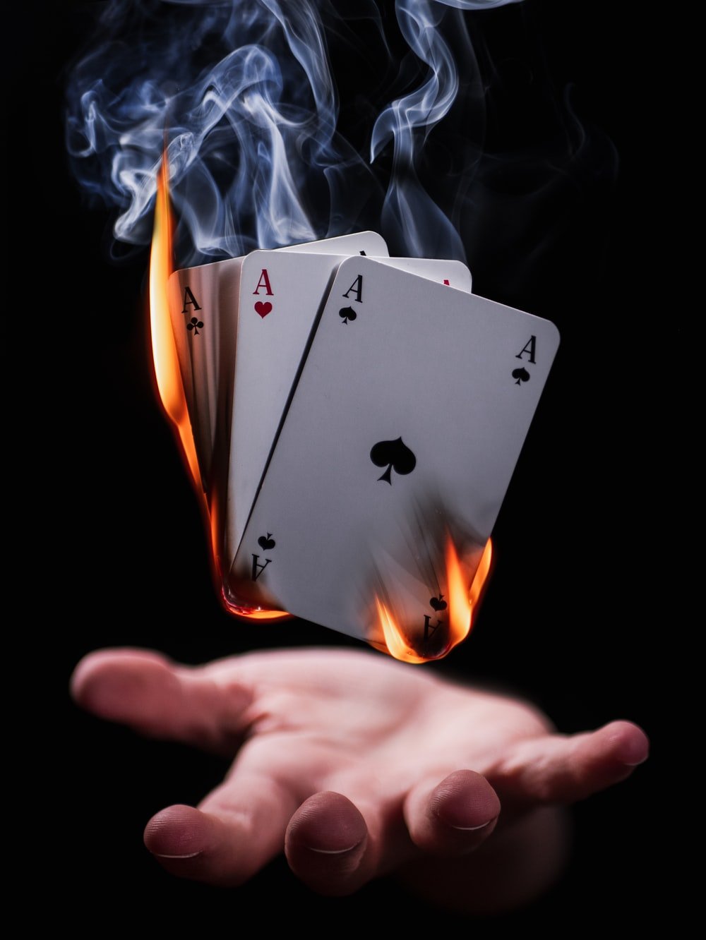 burning playing cards photo