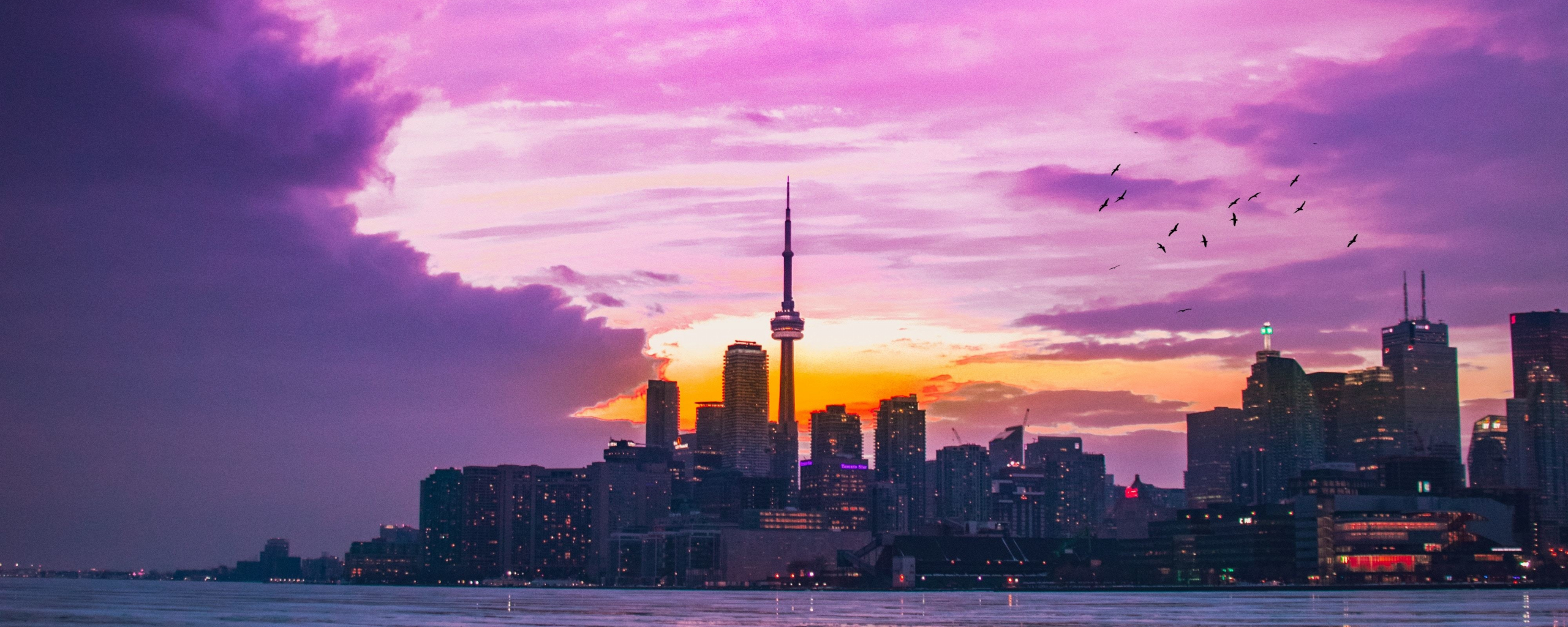 Download city, sunset, pink sky, buildings 2560x1024 wallpaper, dual wide 21:9 2560x1024 HD image, background, 21605