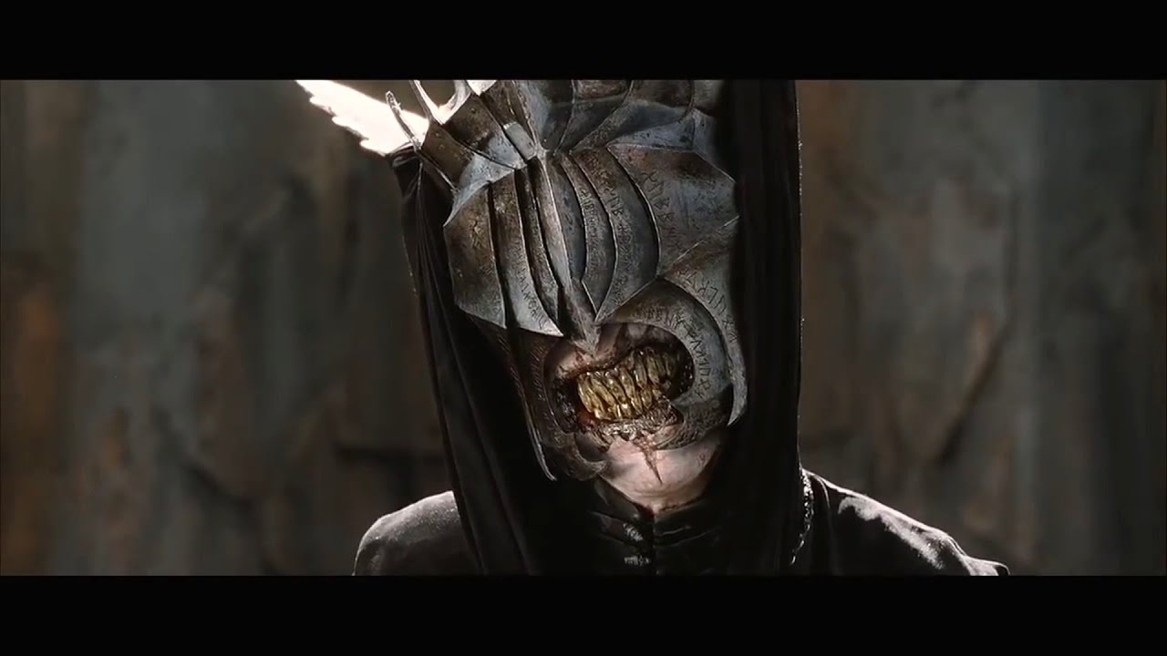 Why did Aragorn behead the Mouth of Sauron in the Return of the King movie, whilst in the book he just talks to him?