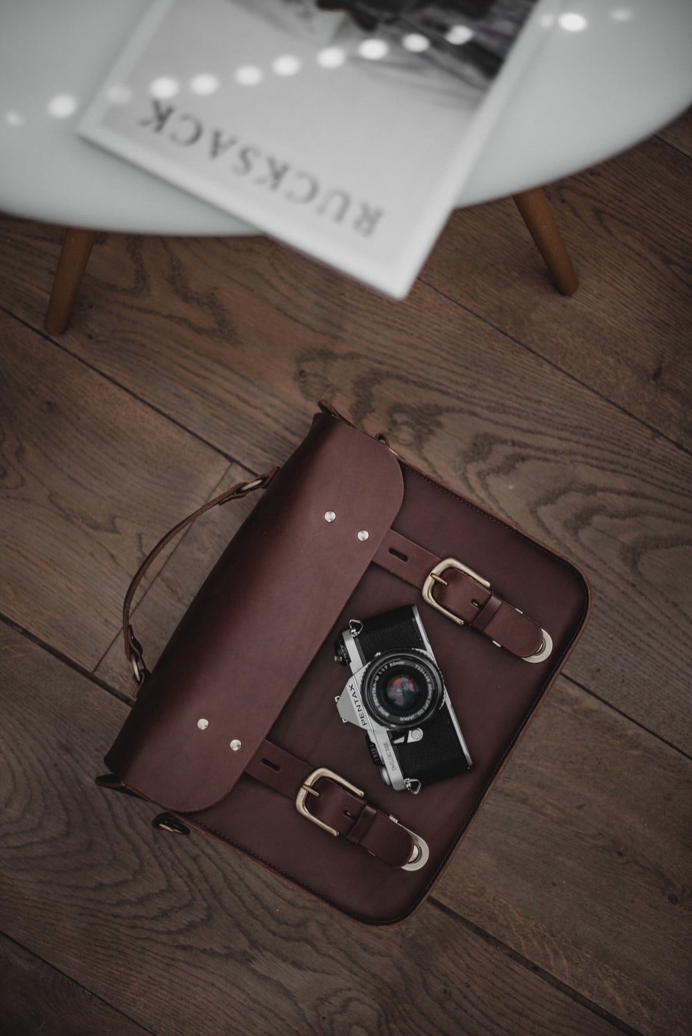 brown leather case on brown surface photo