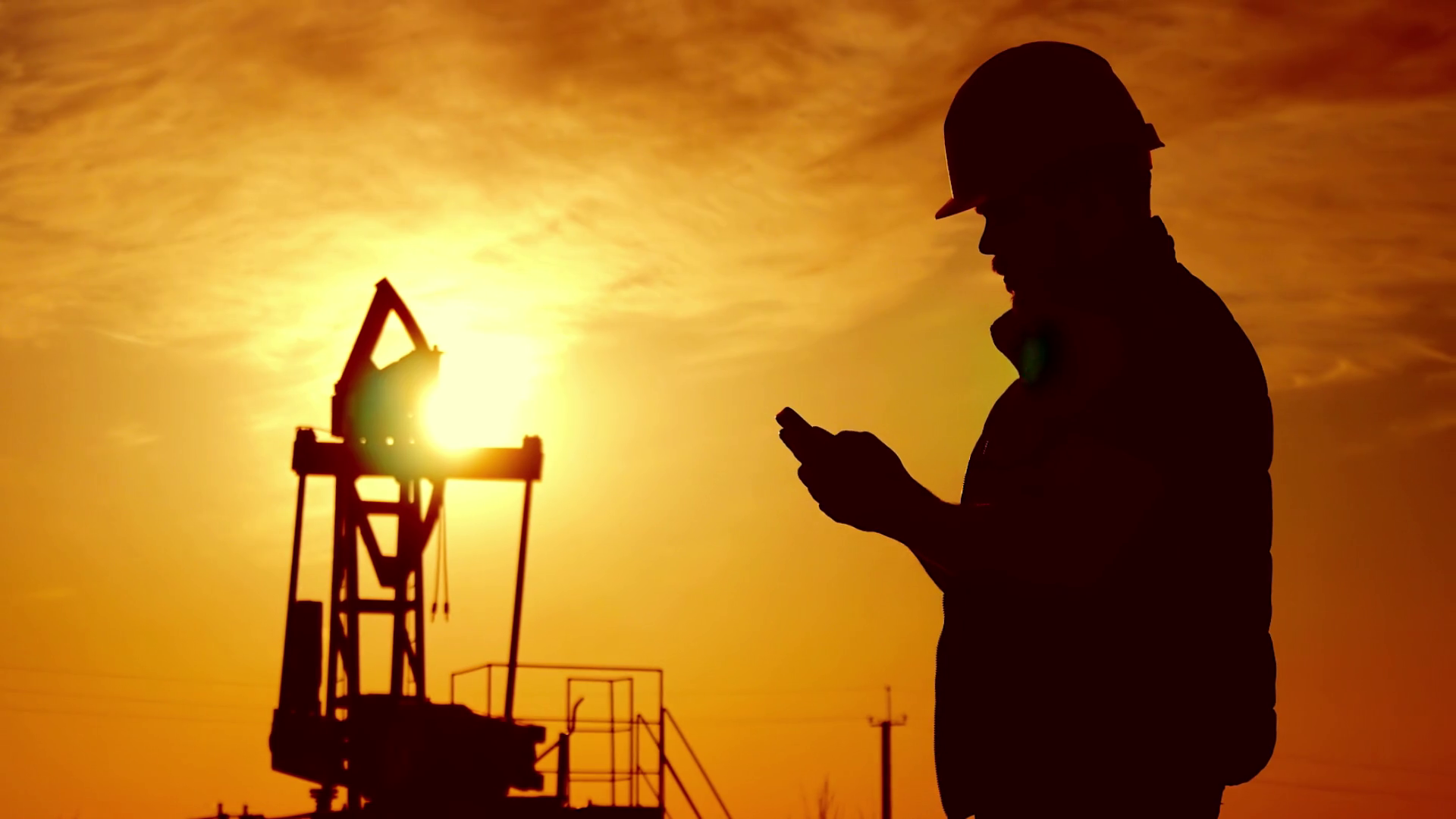 Silhouette Of Oilfield Worker At Crude Oil Pump In Wallpaper & Background Download