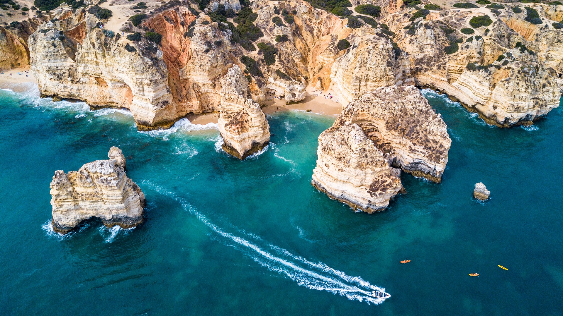 Cliffs and sea stacks of Ponta da Piedade, Lagos, Algarve, Portugal. Windows 10 Spotlight Image
