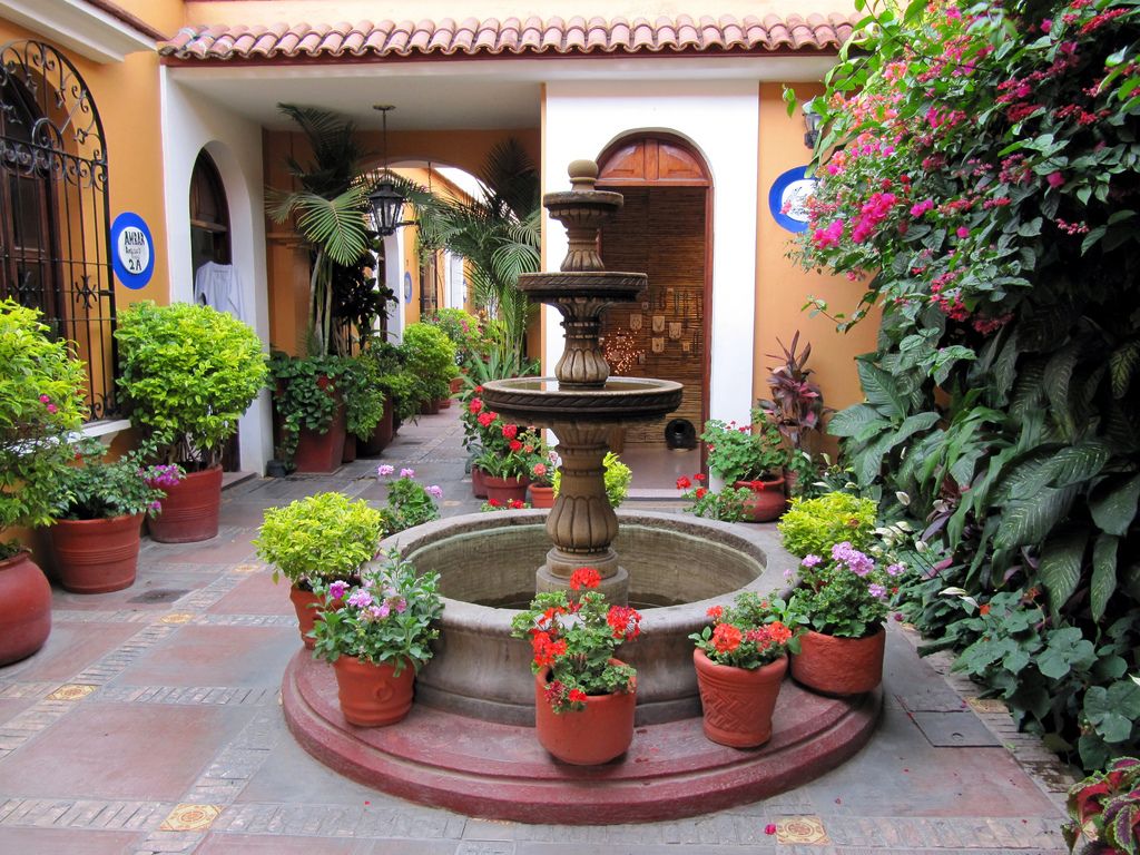 Spanish Courtyard the bell tower into design. Description from .com. I searched for this on bing. Spanish style homes, Spanish style, Mexican patio