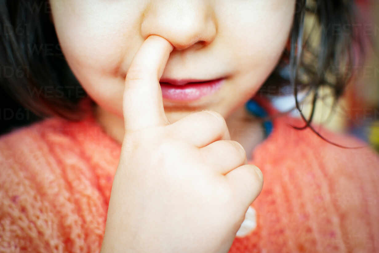 Close Up Of Girl Picking Nose