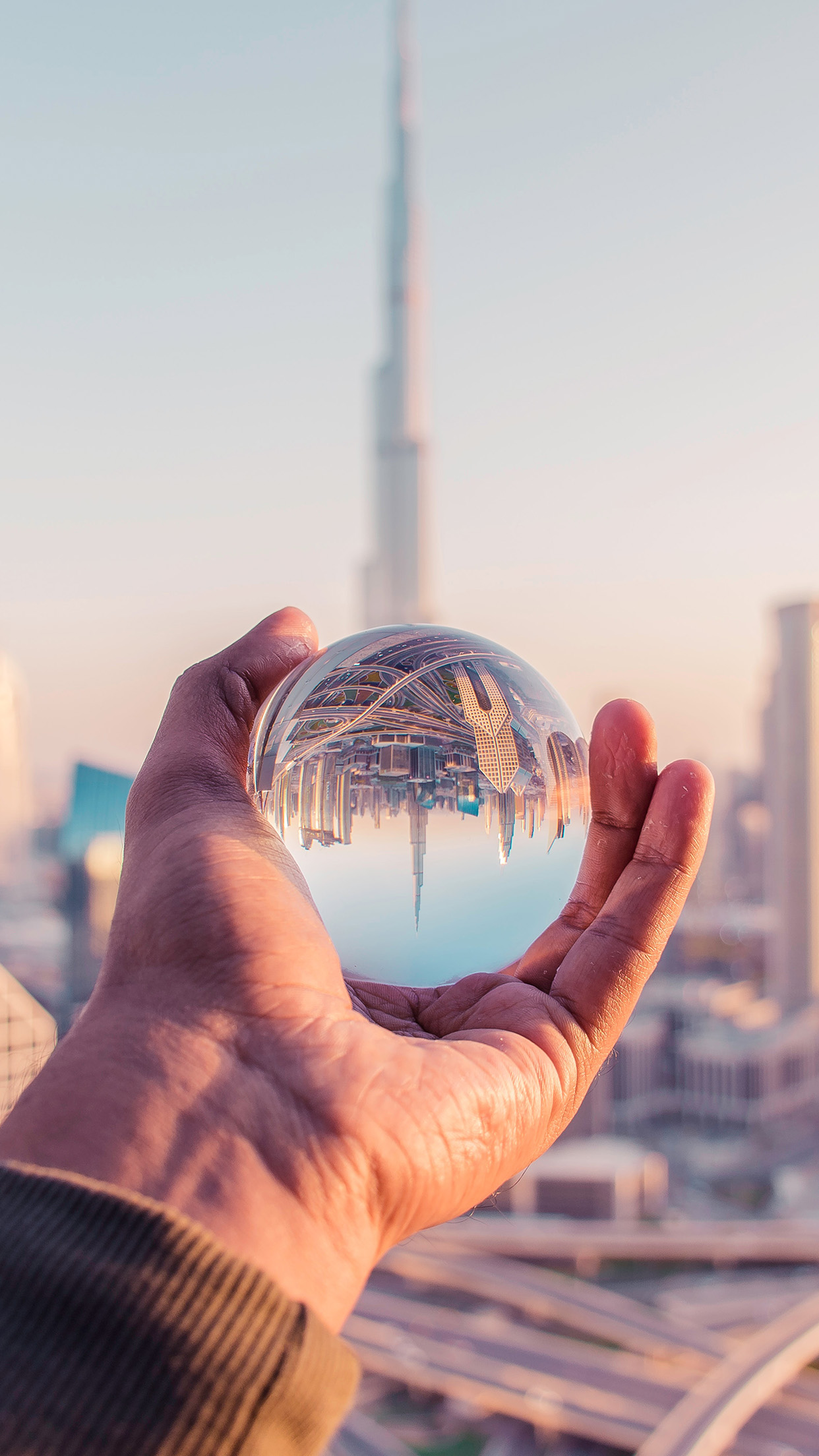 iPhone X wallpaper. dubai tower ball hand nature