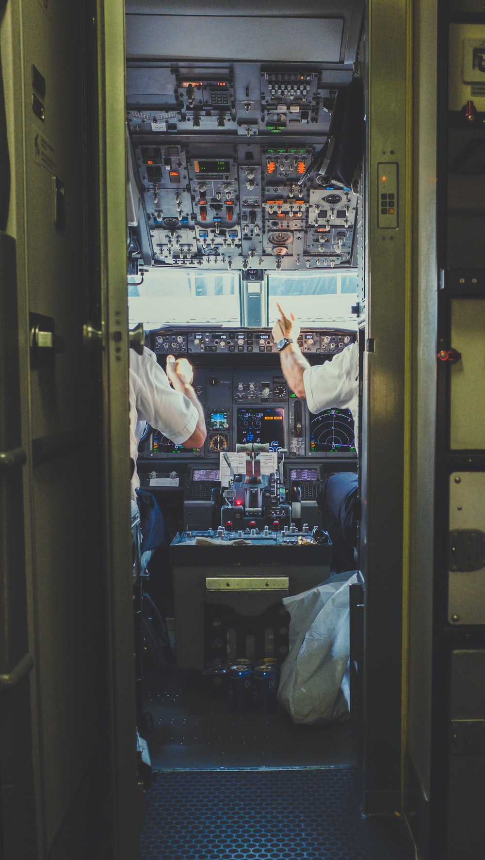 pilot and copilot inside plane cockpit photo