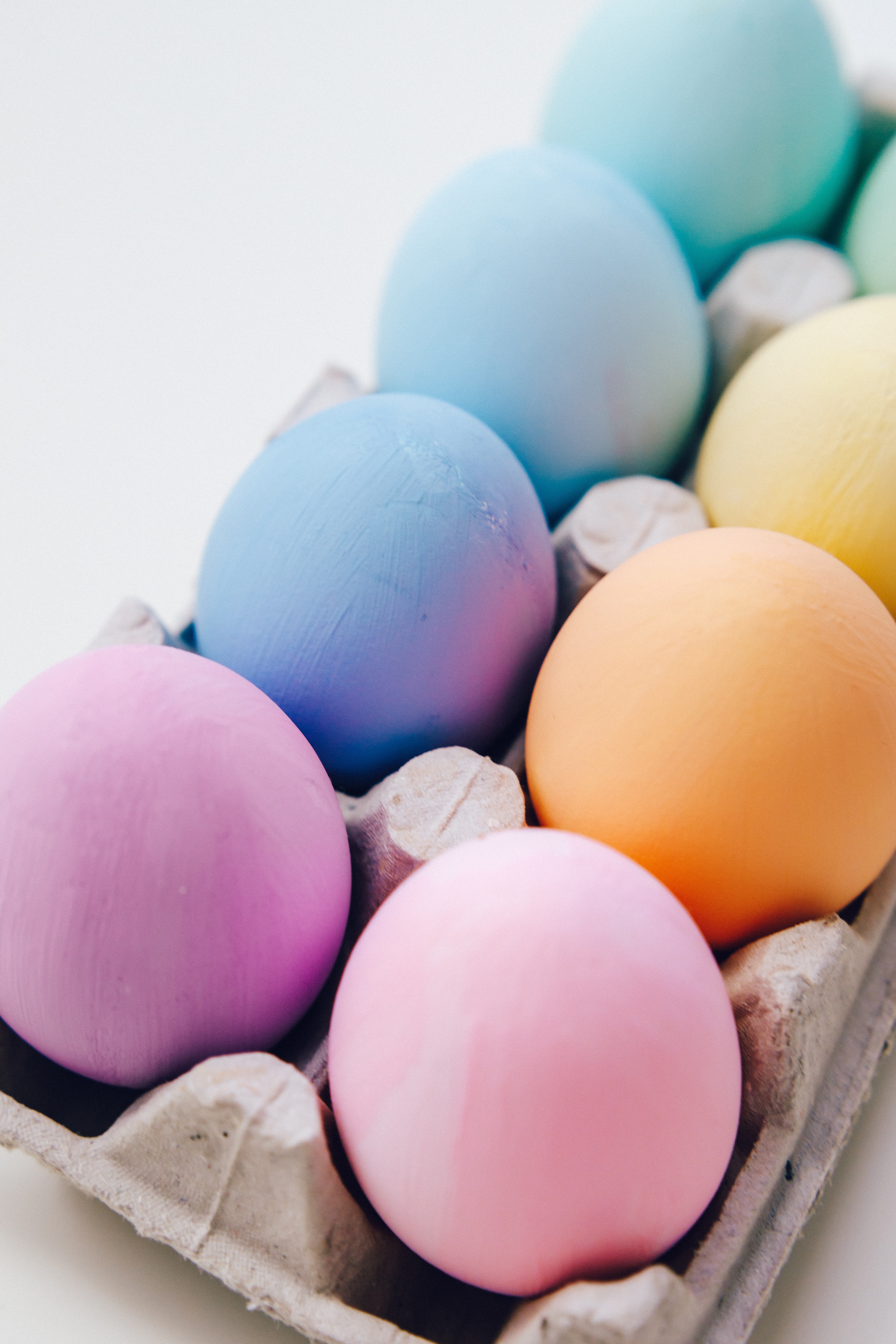 Pastel Colored Eggs In A Carton · Free