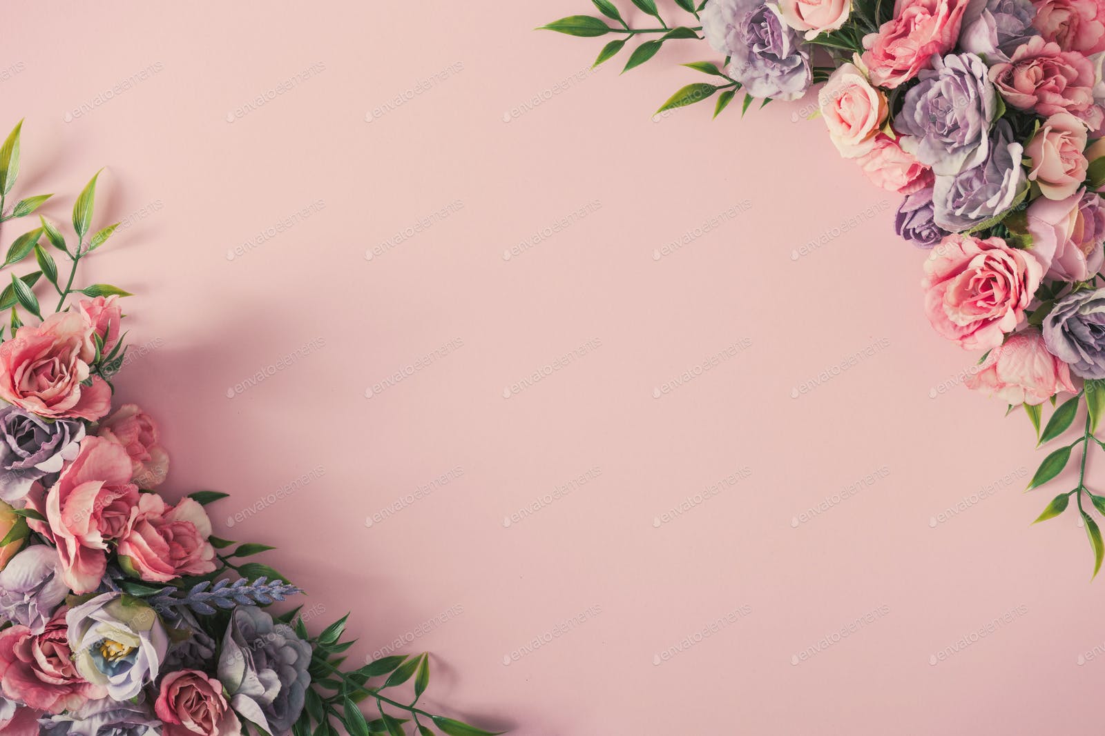 Creative arrangement of colorful flowers on pink background. Spring nature flat lay. photo by zamurovic on Envato Elements