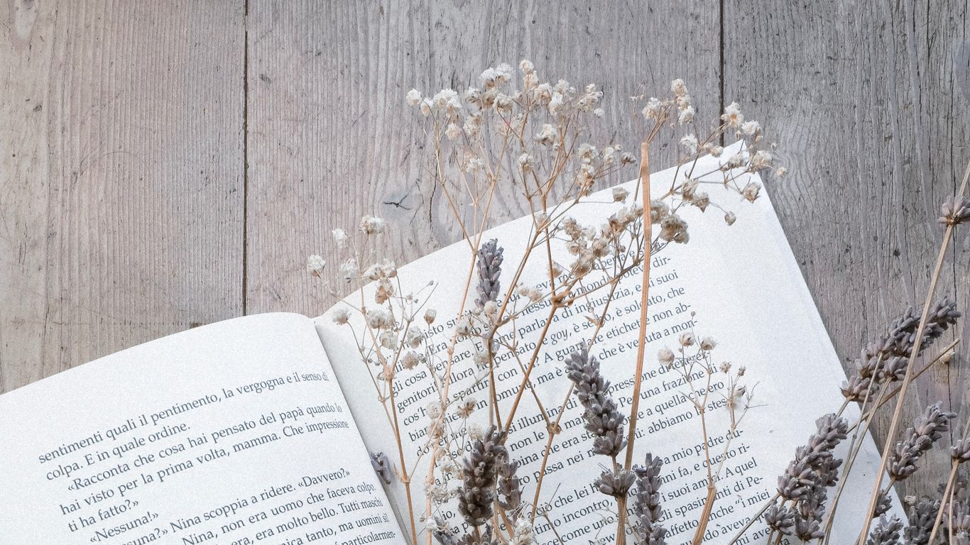 Download wallpaper 1366x768 book, flowers, dried flower, wooden tablet, laptop HD background