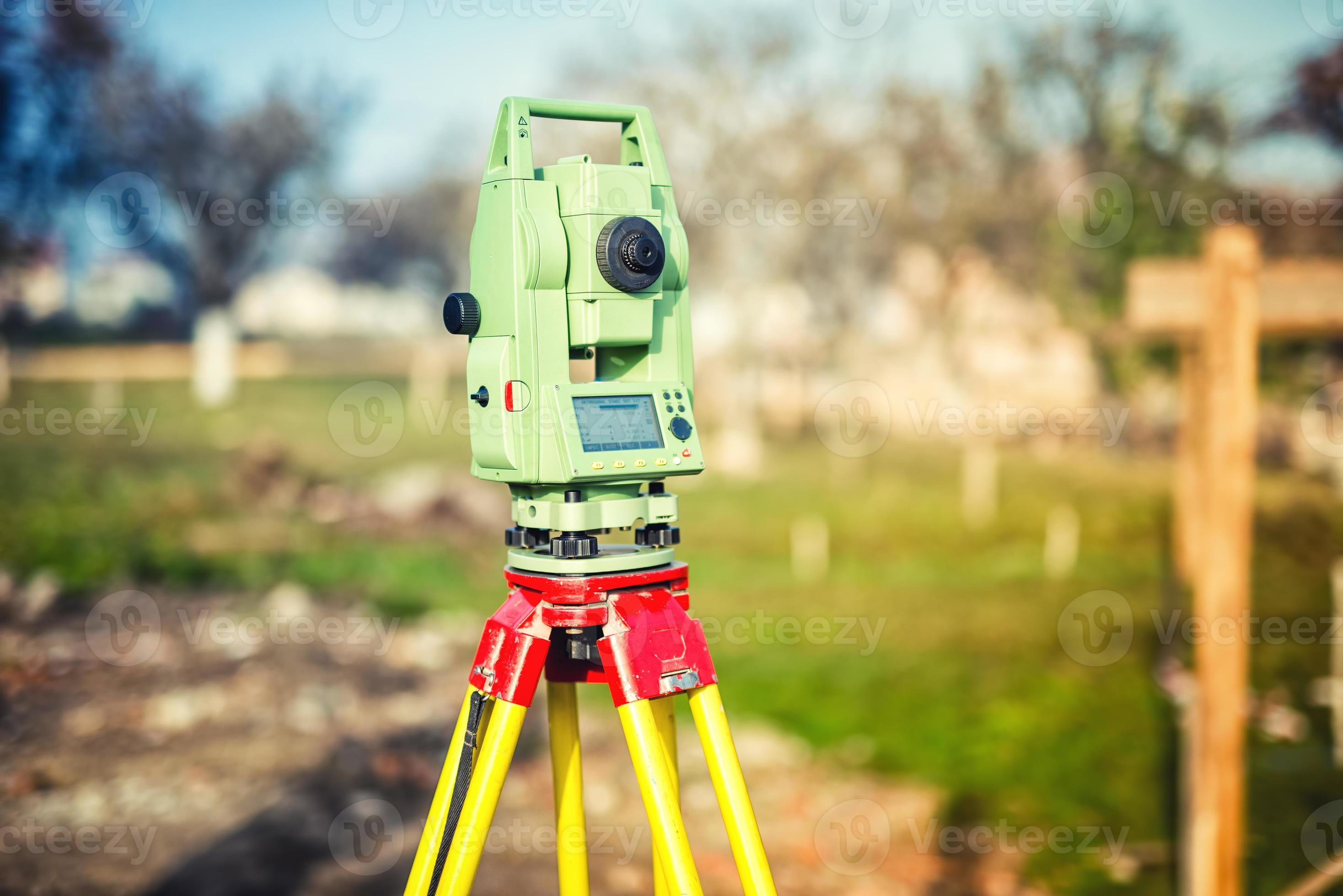 surveyor engineering equipment with theodolite and station at construction site