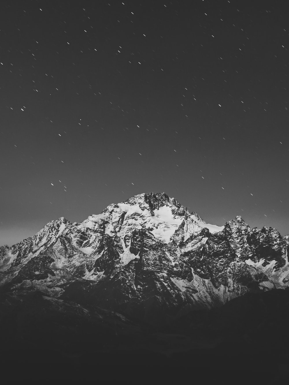 grayscale photo of snow covered mountain photo
