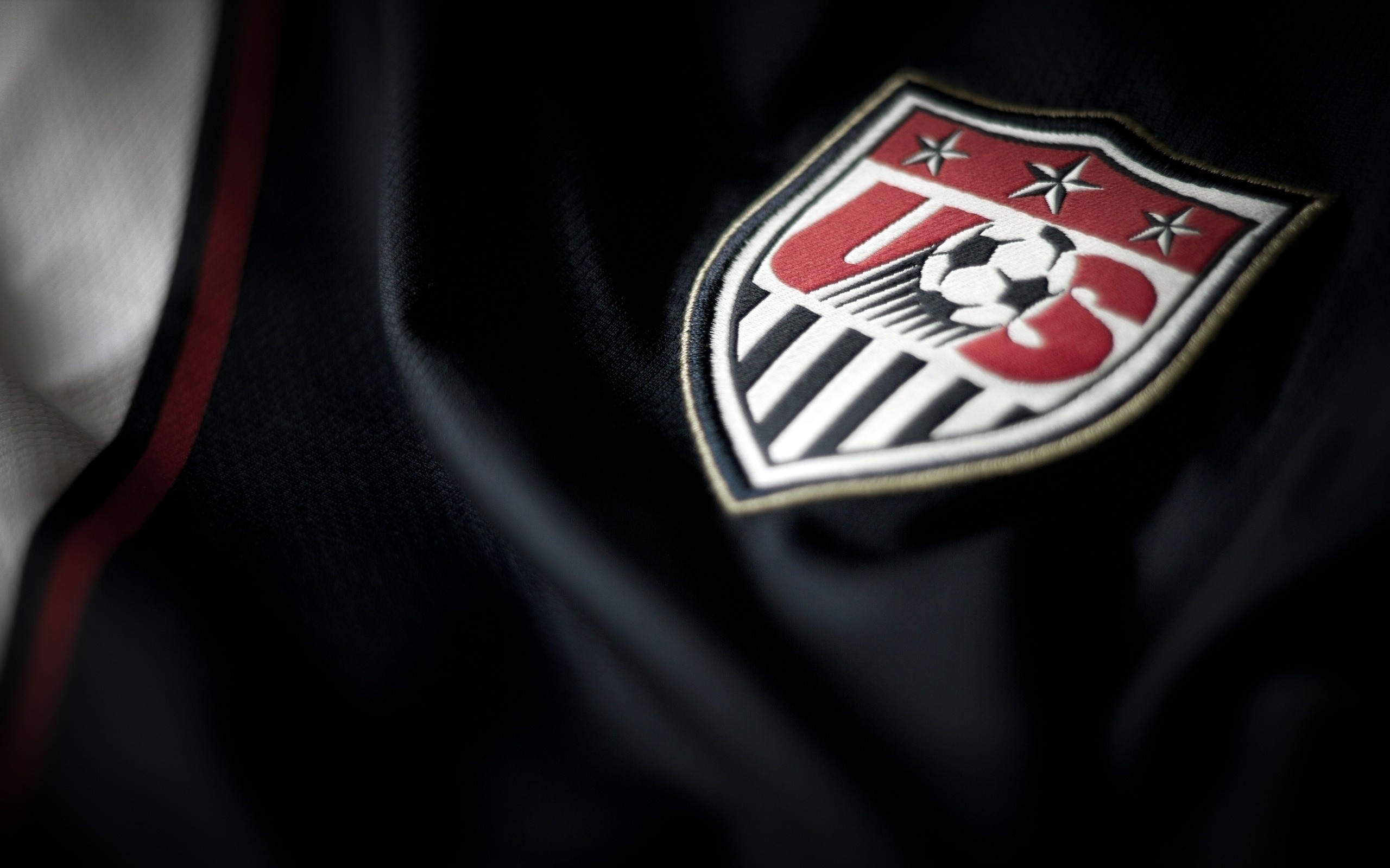 Download wallpaper United States national soccer team, USA, logo, emblem, football, blue fabric, texture for desktop with resolution 2560x1600. High Quality HD picture wallpaper