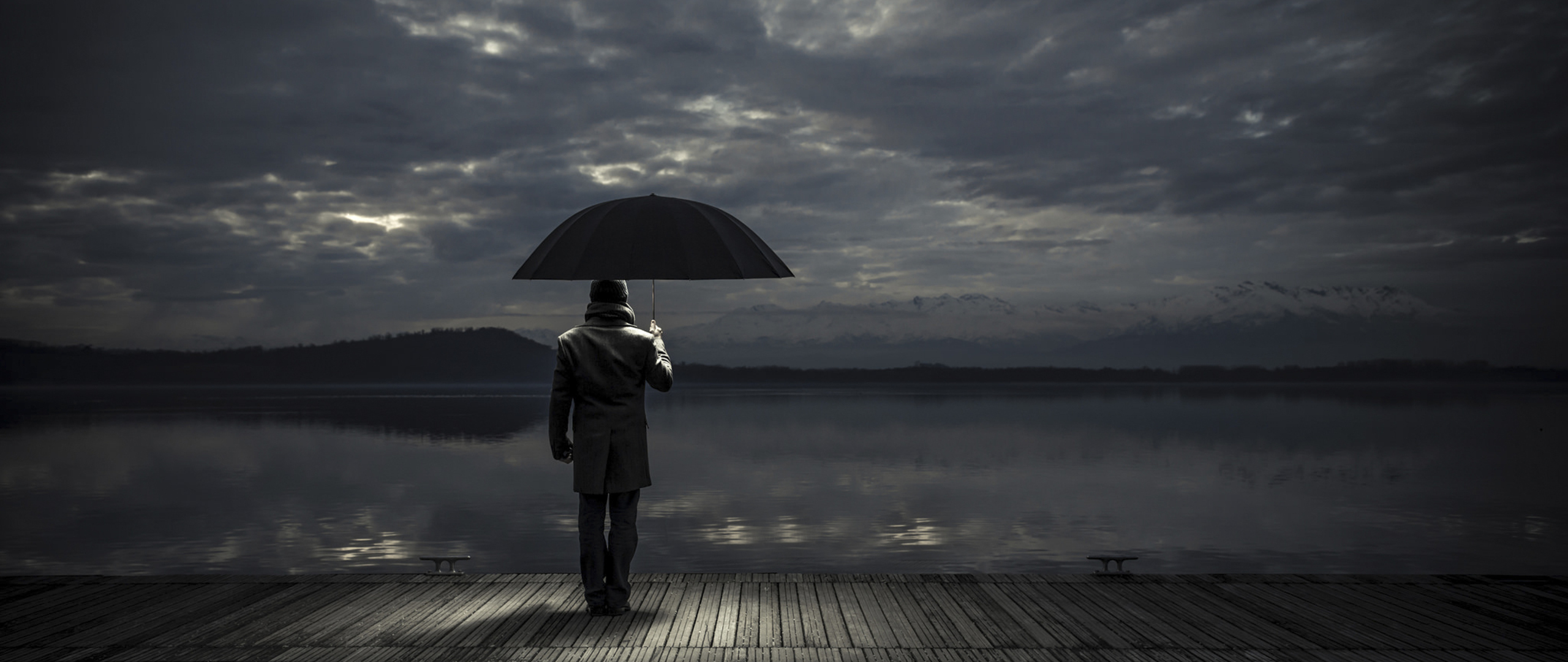 man alone crying in rain