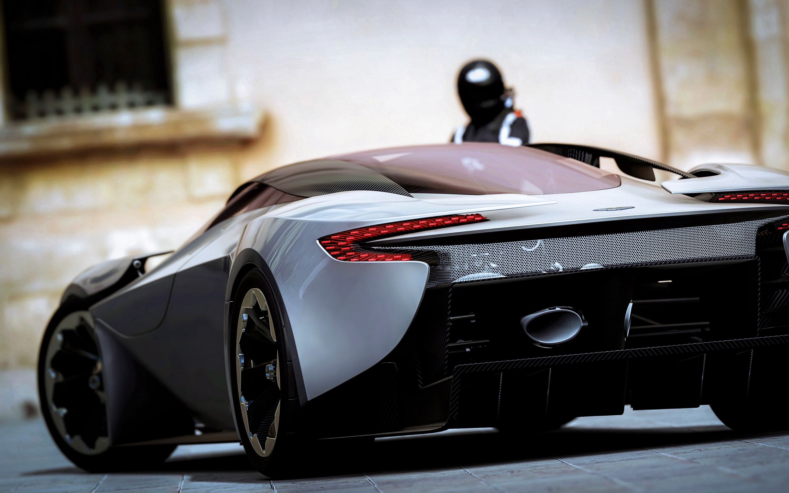 Download wallpaper 2560x1600 aston martin, rear view, black, sports car widescreen 16:10 HD background