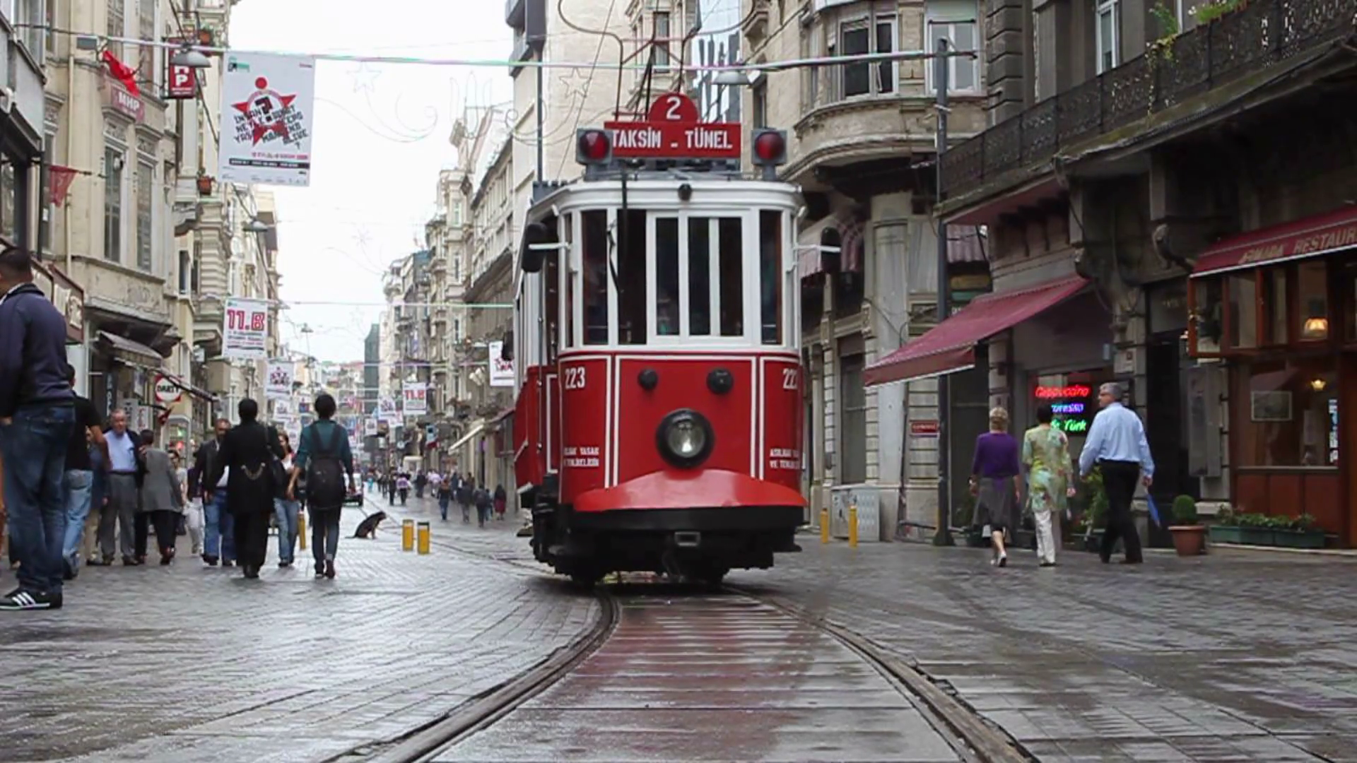 ISTANBUL, TURKEY, 2009: A tram travels from Taksim square along the touristic Istiklal shopping street Stock Video Footage