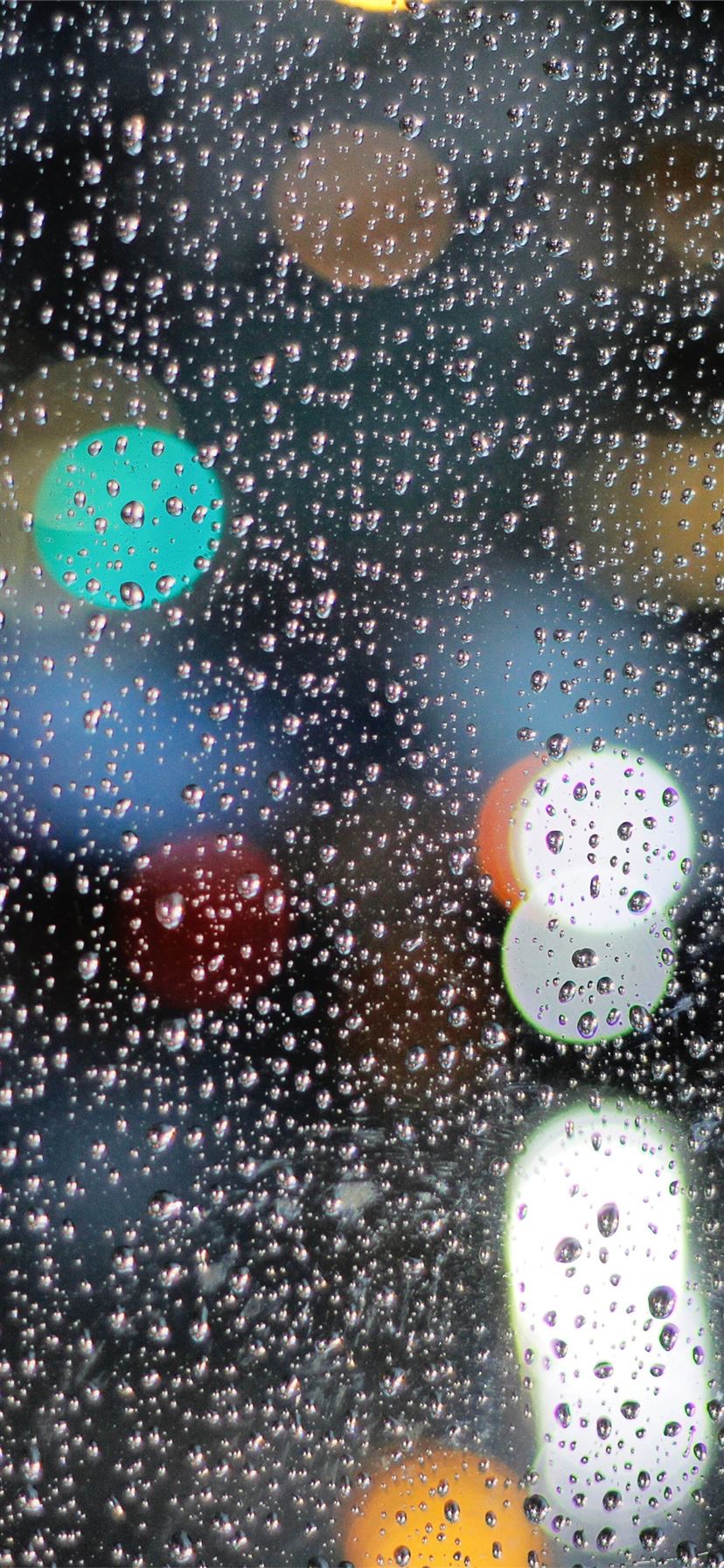 rainy day drops on glass lights bokeh 5k iPhone 11 Wallpaper Free Download