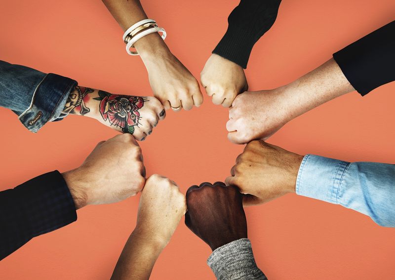 Group Hand Fist Bump Image Wallpaper