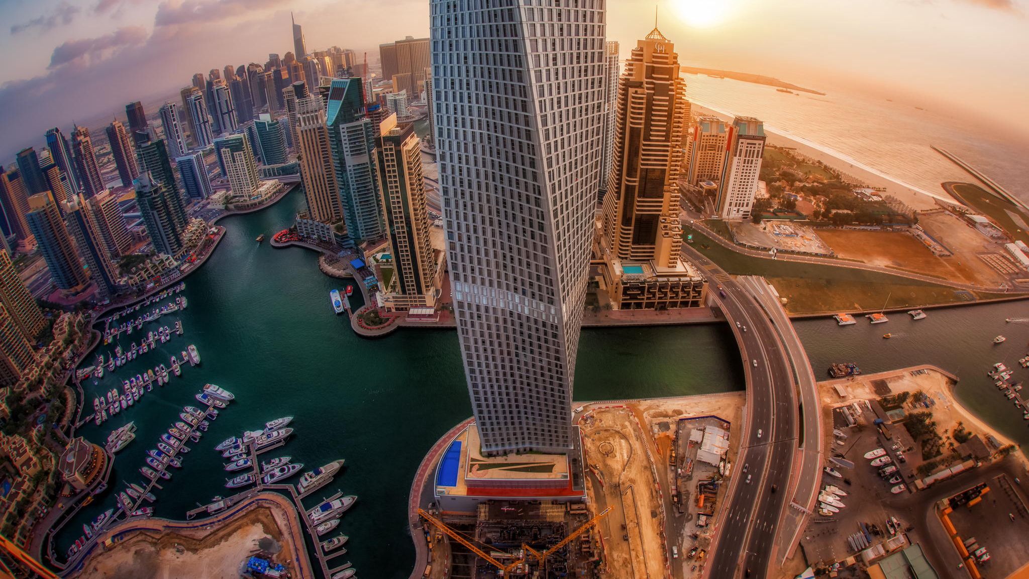 Download wallpaper 2048x1152 united arab emirates, skyscrapers, top view, sunrise, city, dubai ultrawide monitor HD background