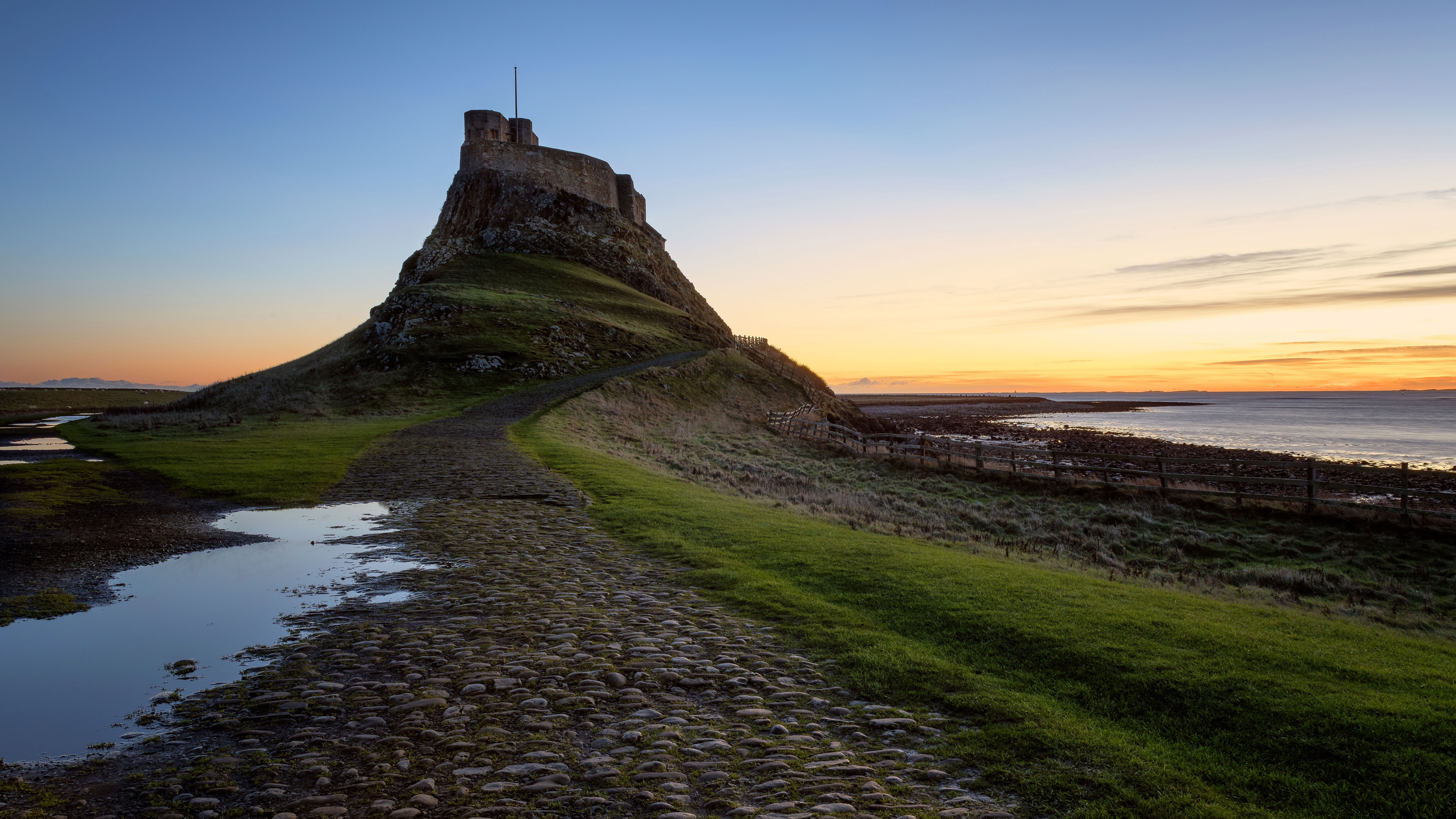 Lindisfarne Castle at dawn, Holy Island, Northumberland, England by Karen Deakin 4k Ultra HD Wallpaper
