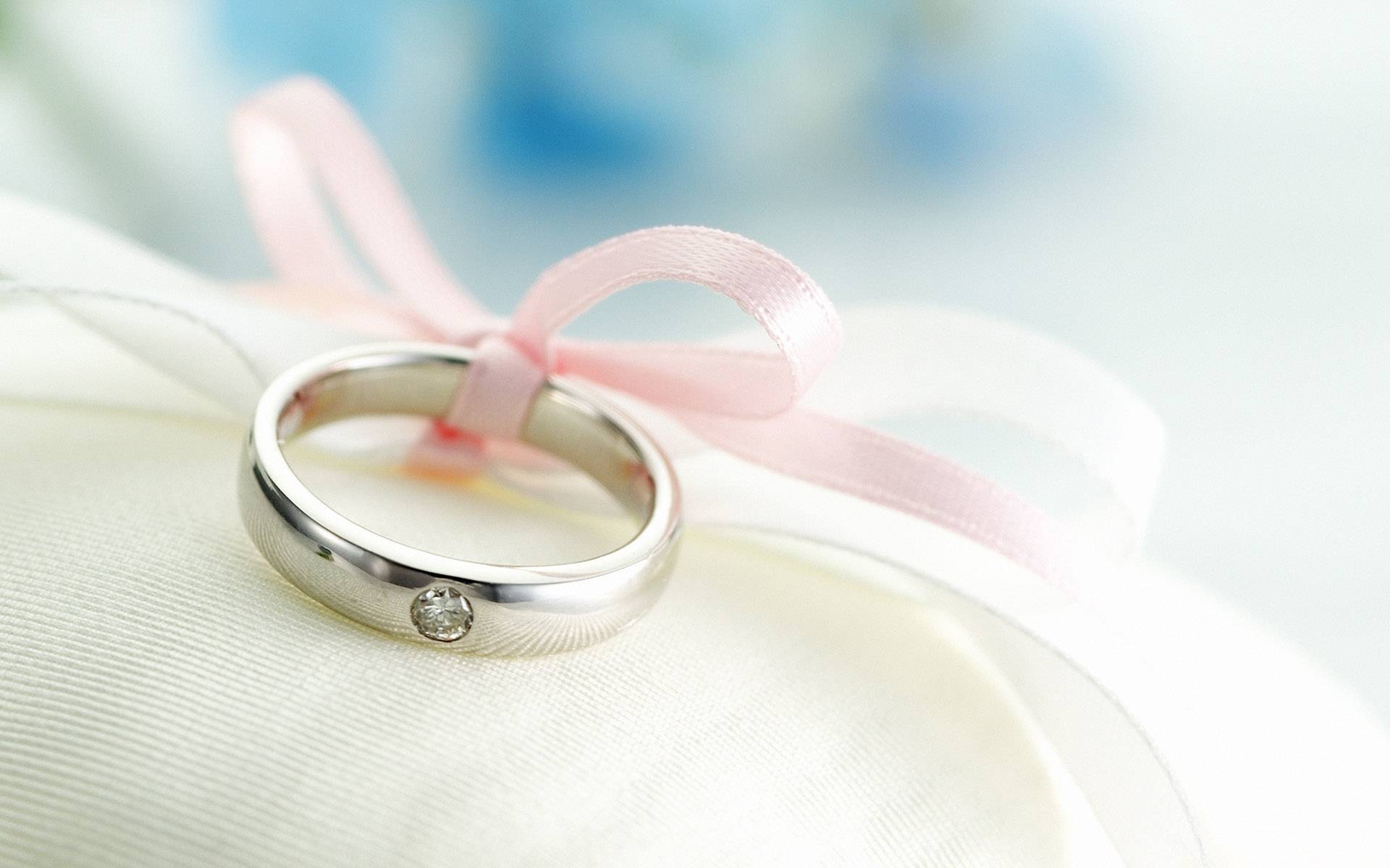 wedding rings aqua blue background