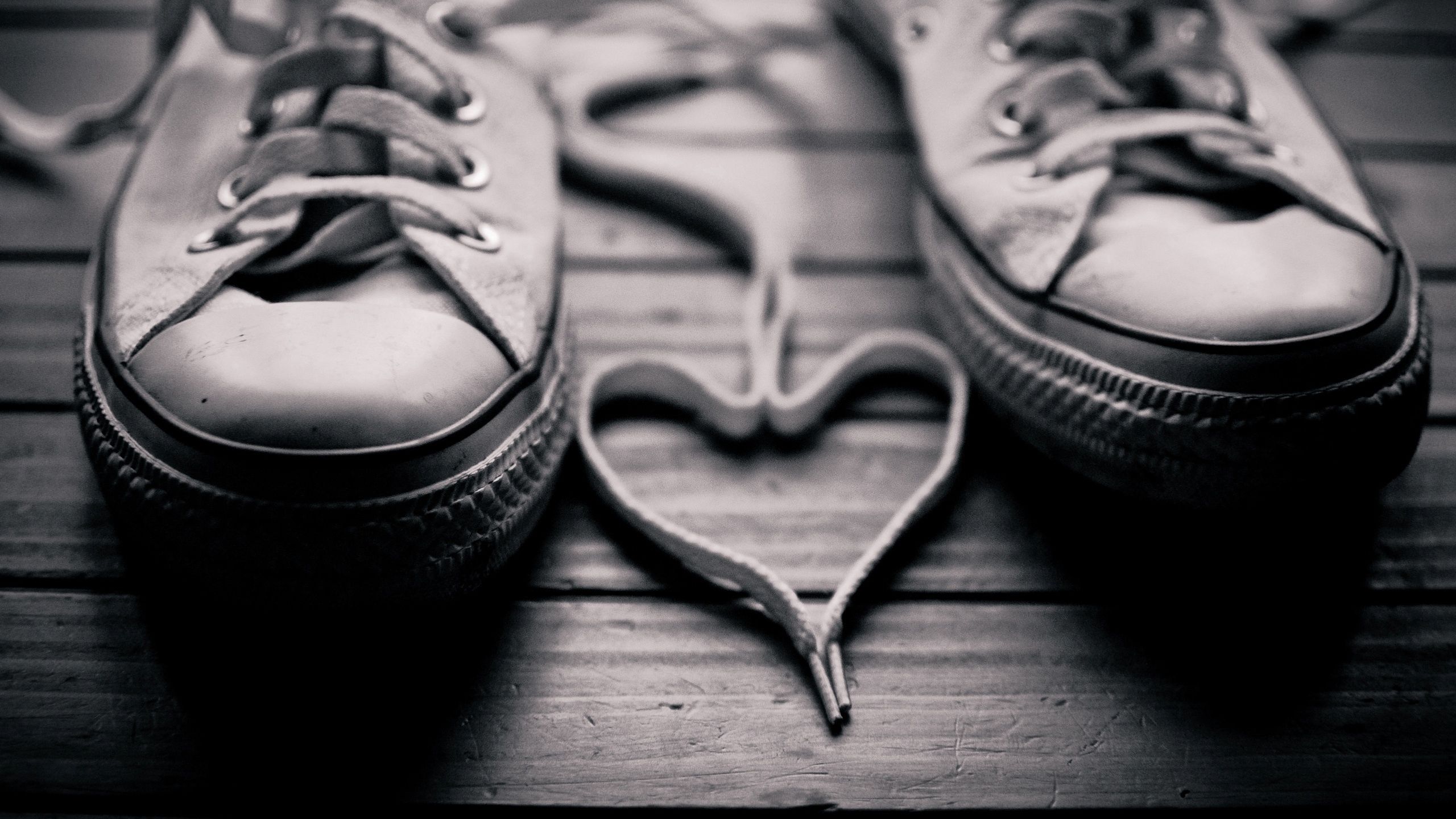 Download wallpaper 2560x1440 shoes, shoe laces, black white, sepia, mood widescreen 16:9 HD background