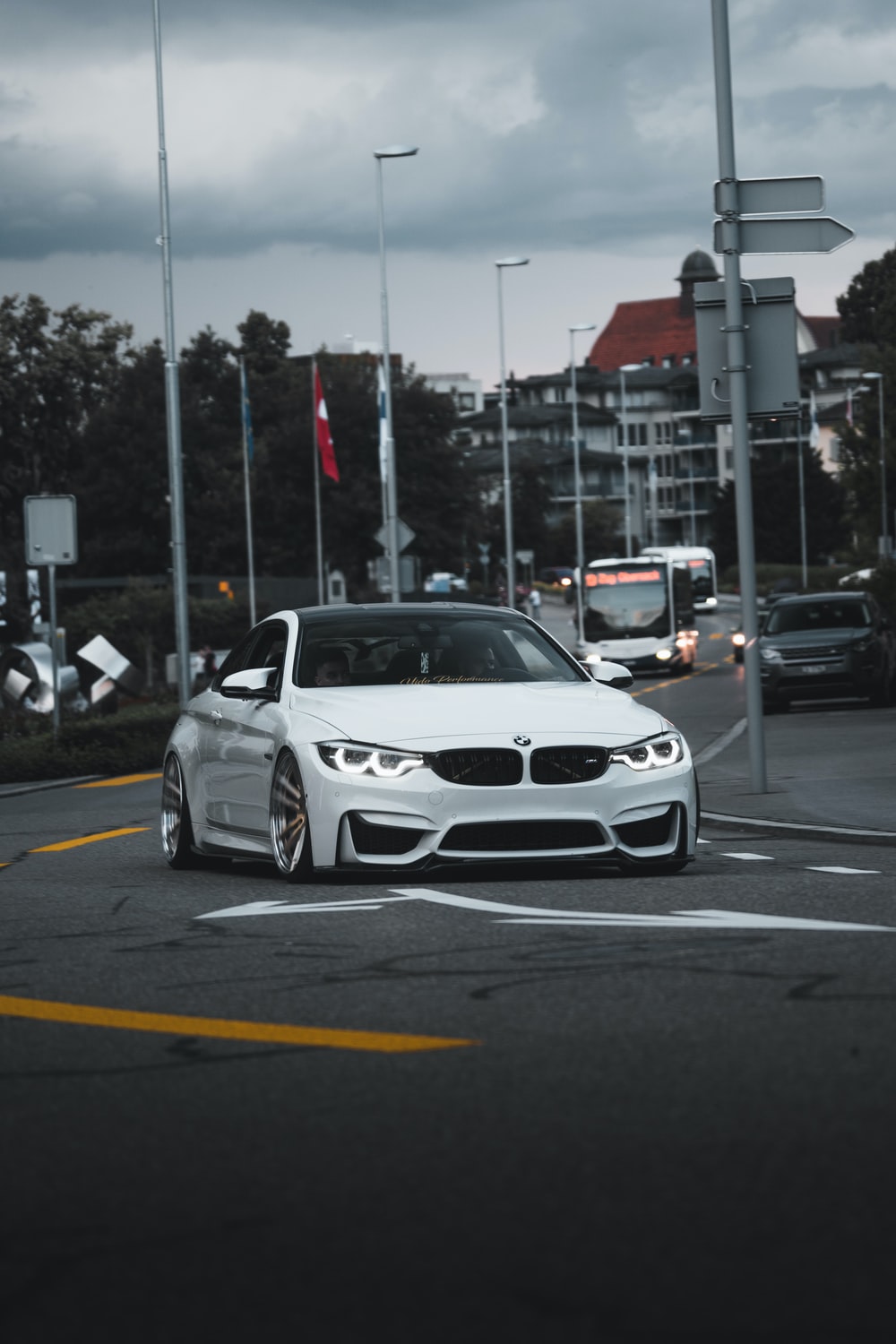 white bmw m 3 on road during daytime photo