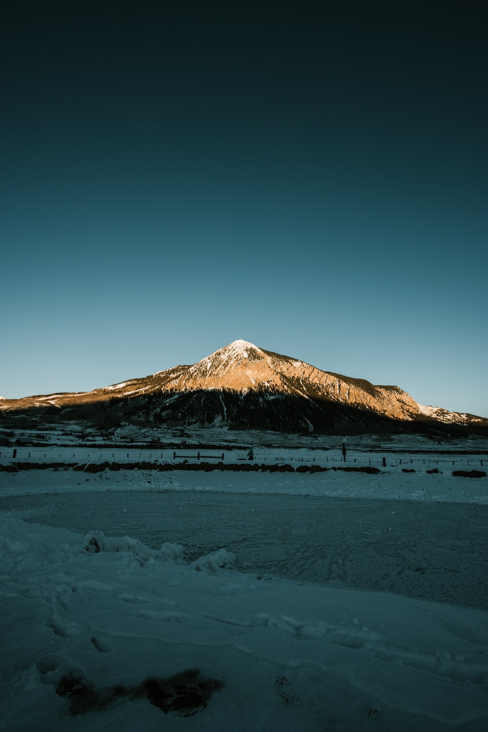 brown mountain under blue sky during daytime photo