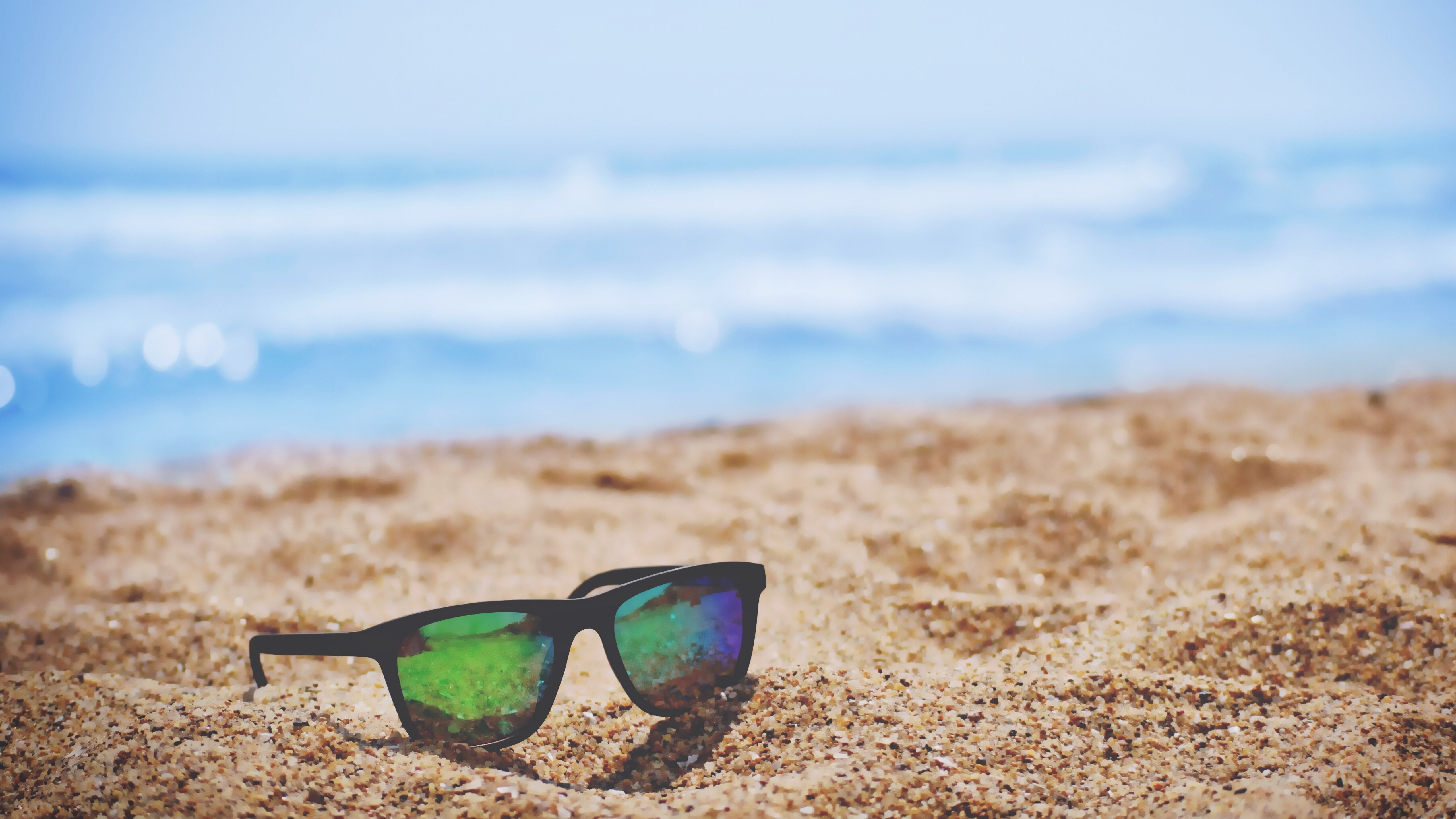 Sunglasses on Beach 5K Wallpaper