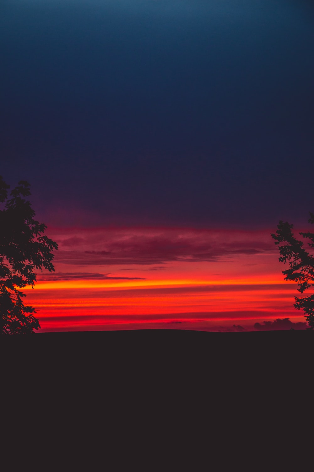 crimson sky at sunset photo