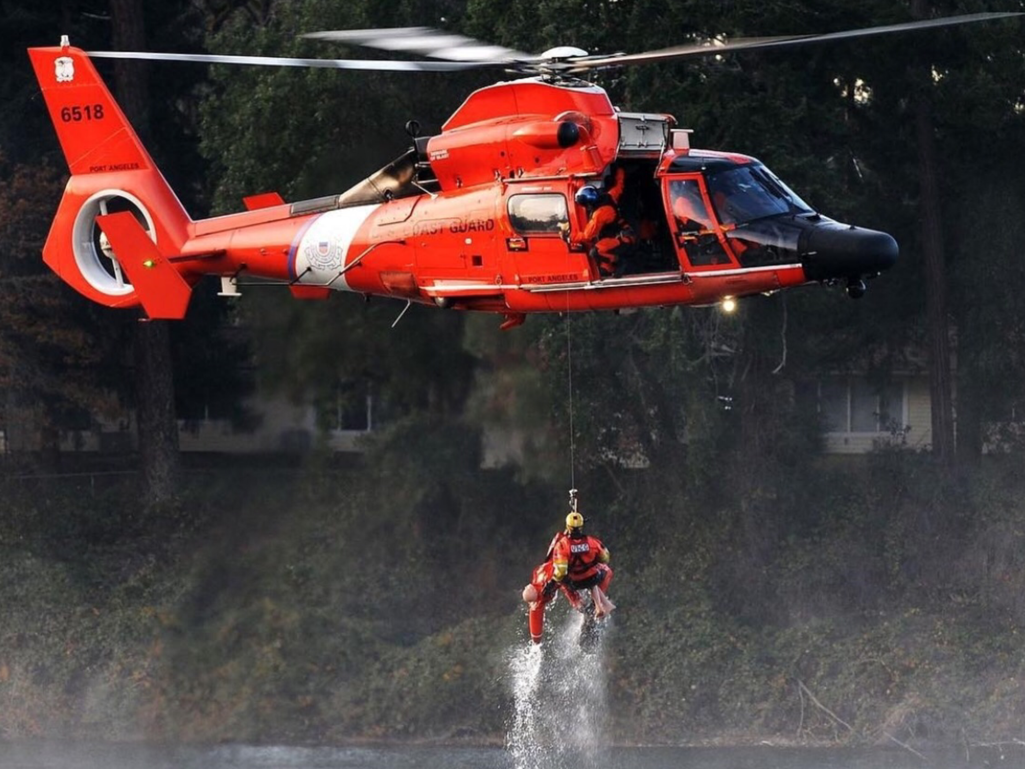 Coast Guard 6518 hoisting her Rescue Swimmer. Coast guard rescue swimmer, Coast guard rescue, Coast guard