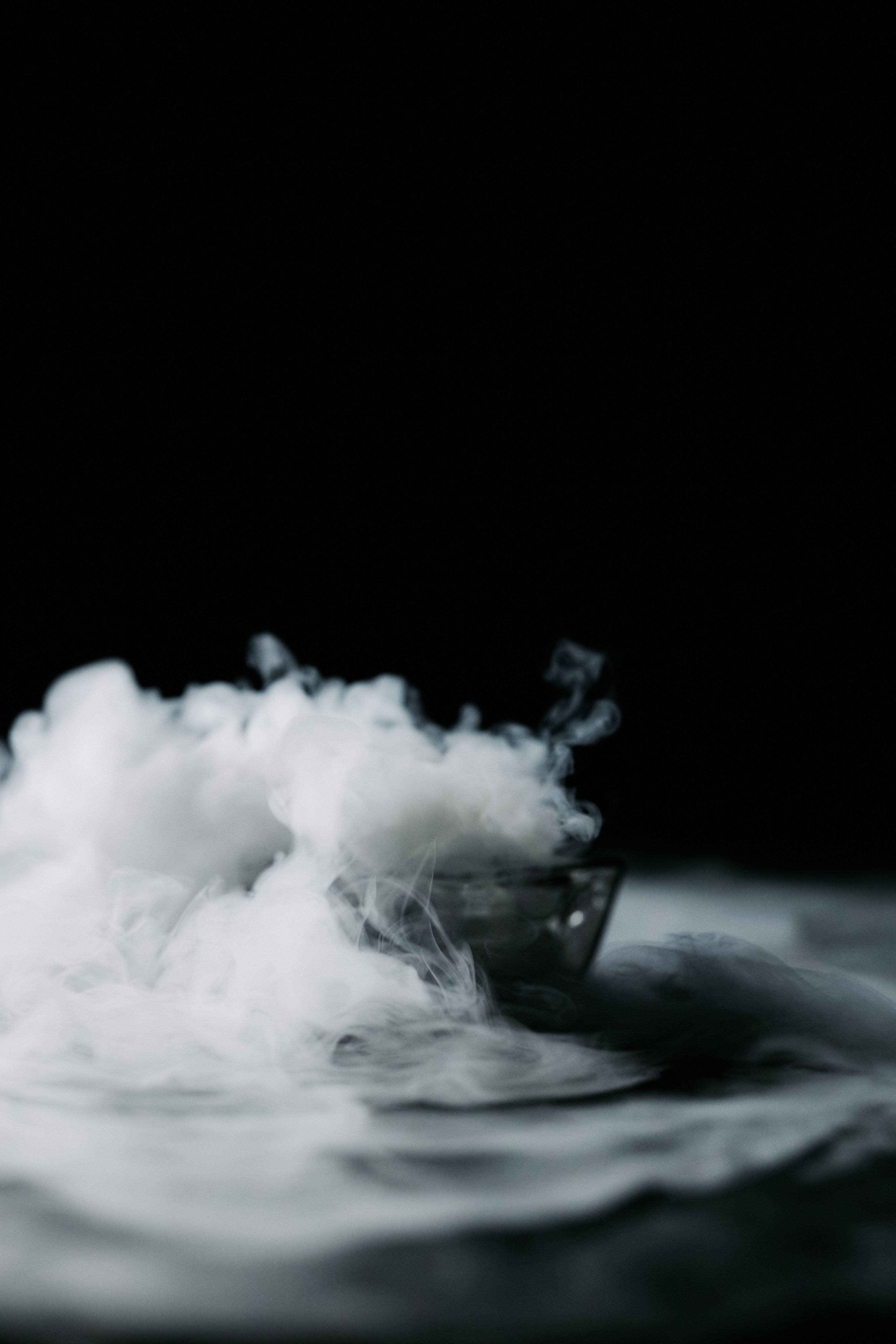 A Thick White Smoke Against Black Background · Free
