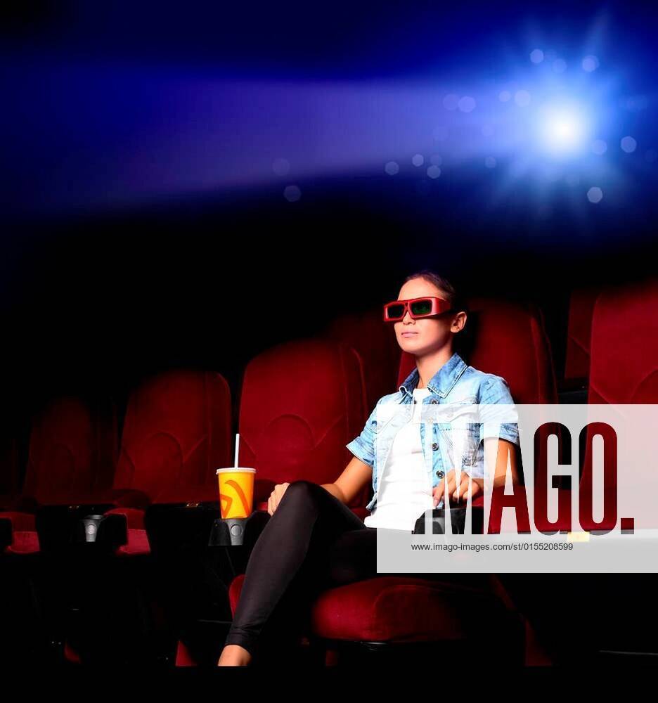 One young girl watching movie in cinema xFotosearchxLBRFx xSergeyNivensx ESY 027473141