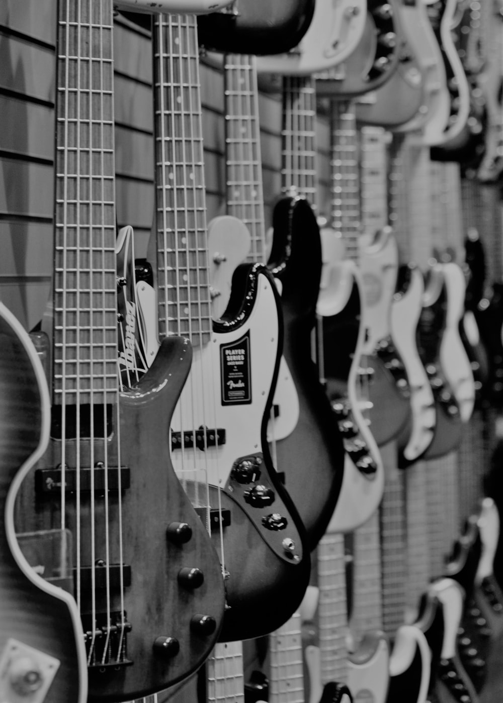 grayscale photo of electric guitars photo