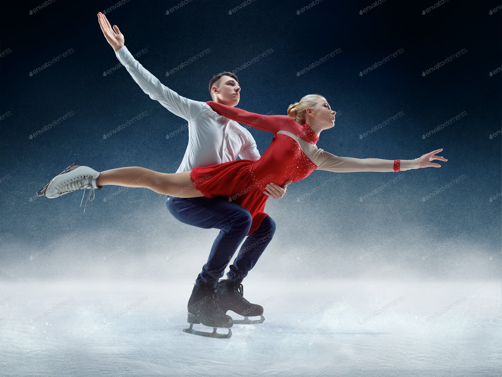 Professional man and woman figure skaters performing on ice show photo by master1305 on Envato Elements