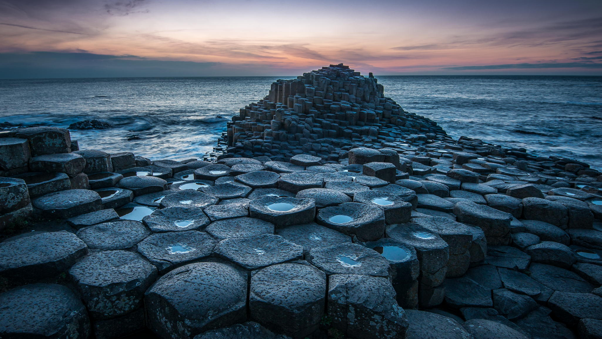 The Giant's Causeway area of about 40,000 interlocking basalt columns on the northeast coast of Northern Ireland by Greg Sinclair [1920x1080]