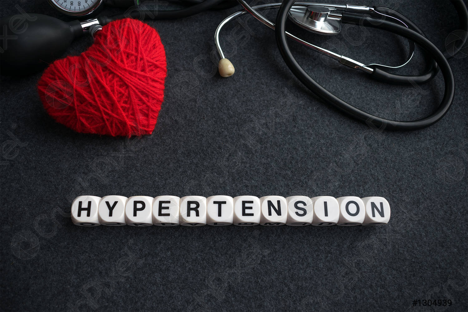 Word heart hypertension from white cubes with letters on dark