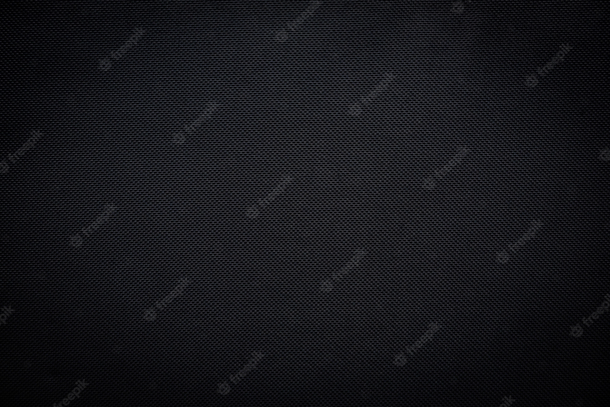 Premium Photo. Black woven carbon fiber sheet texture background