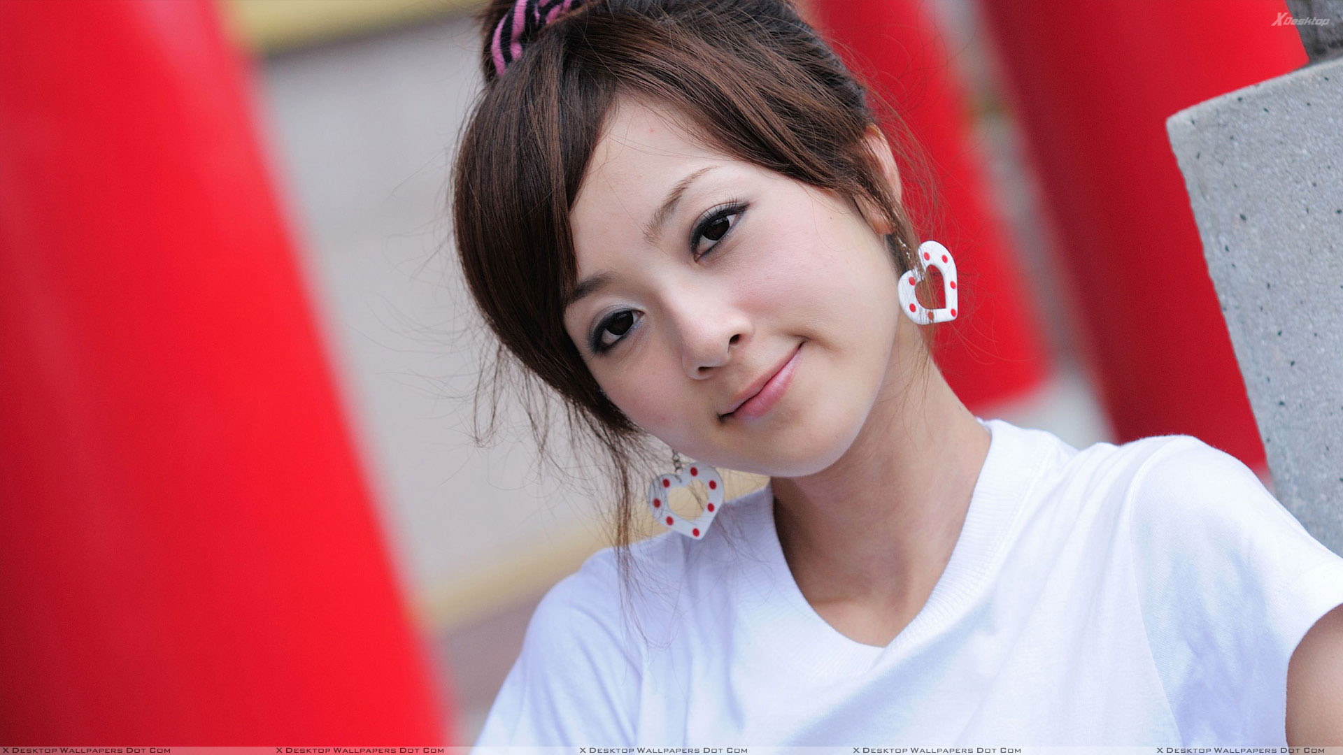 Cute Smiling Face Of Asian Girl in White Top And White Earings Wallpaper