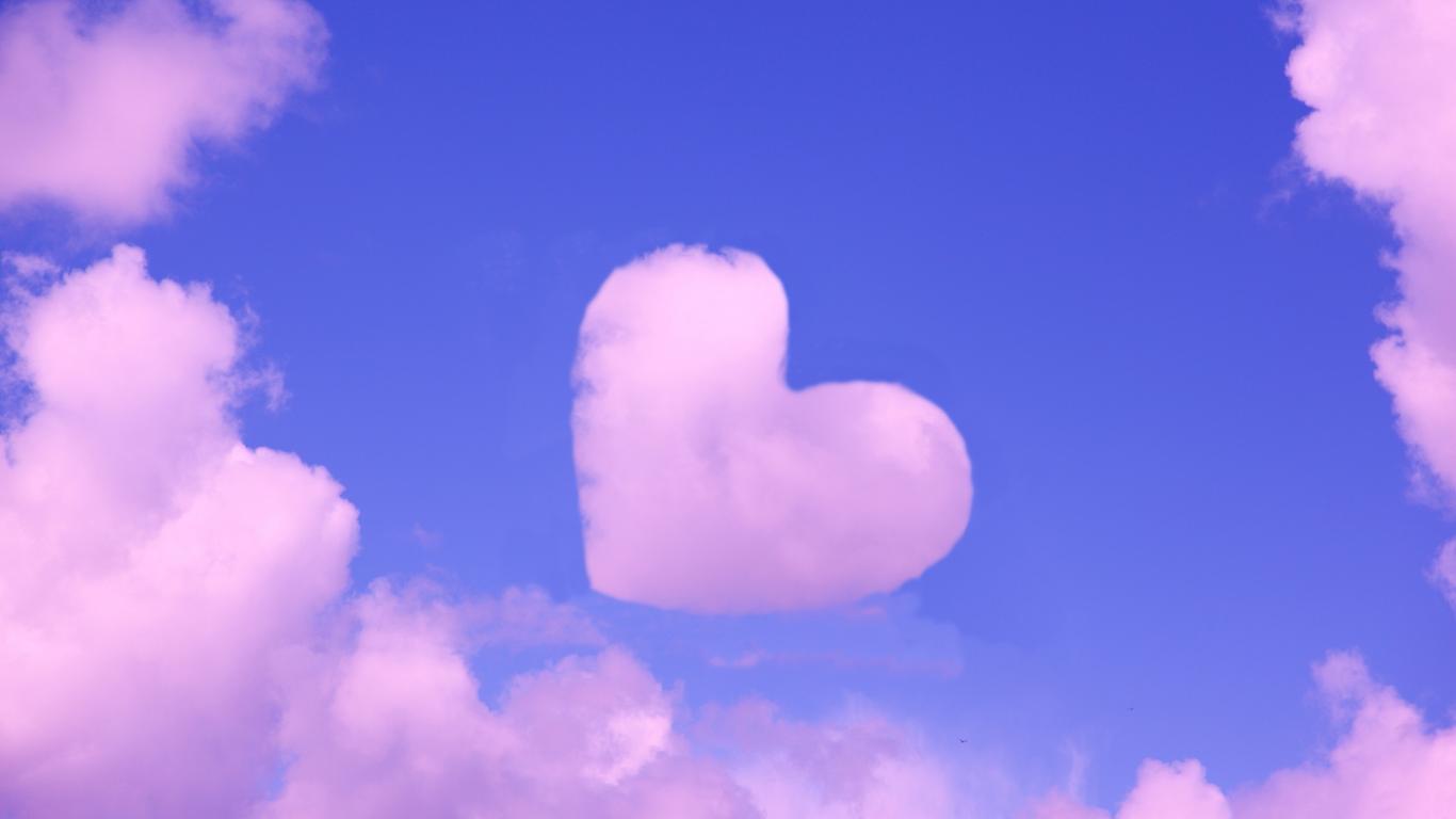 Pink heart cloud on the blue sky