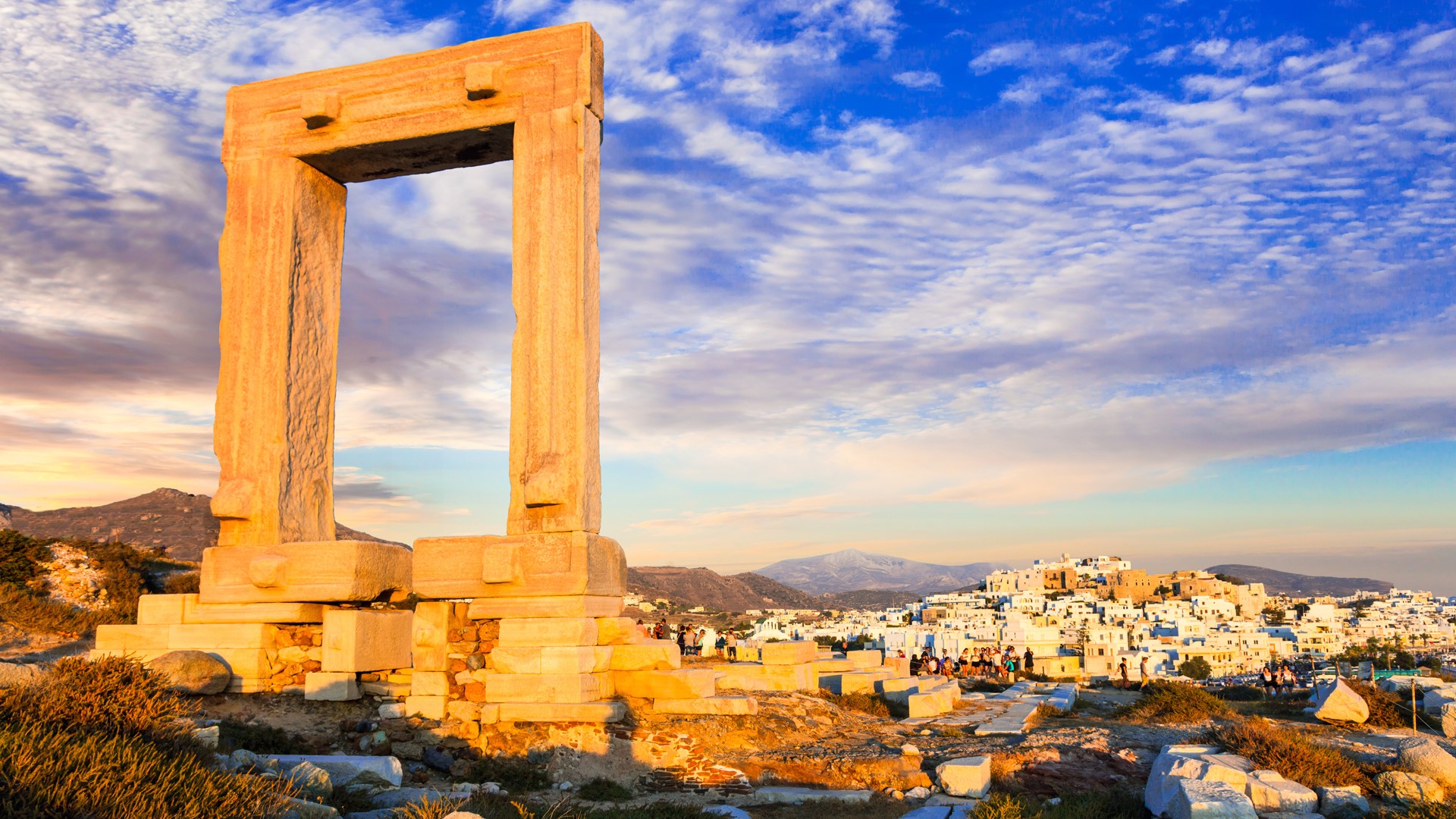Apollo Temple's entrance ruins, Portara Gate at sunset, Naxos Island, Greece. Windows 10 Spotlight Image