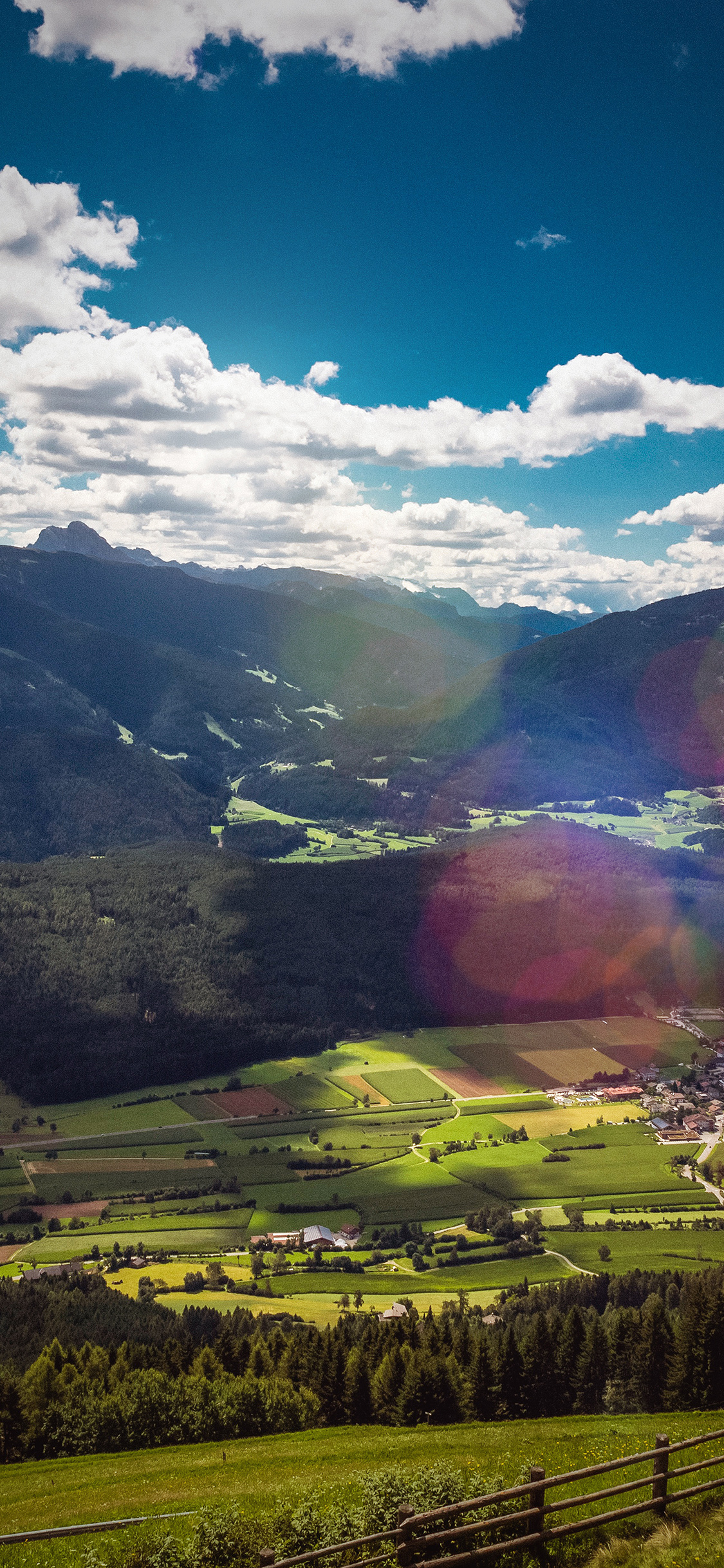 iPhone X wallpaper. nature town sky cloud mountain green summer flare
