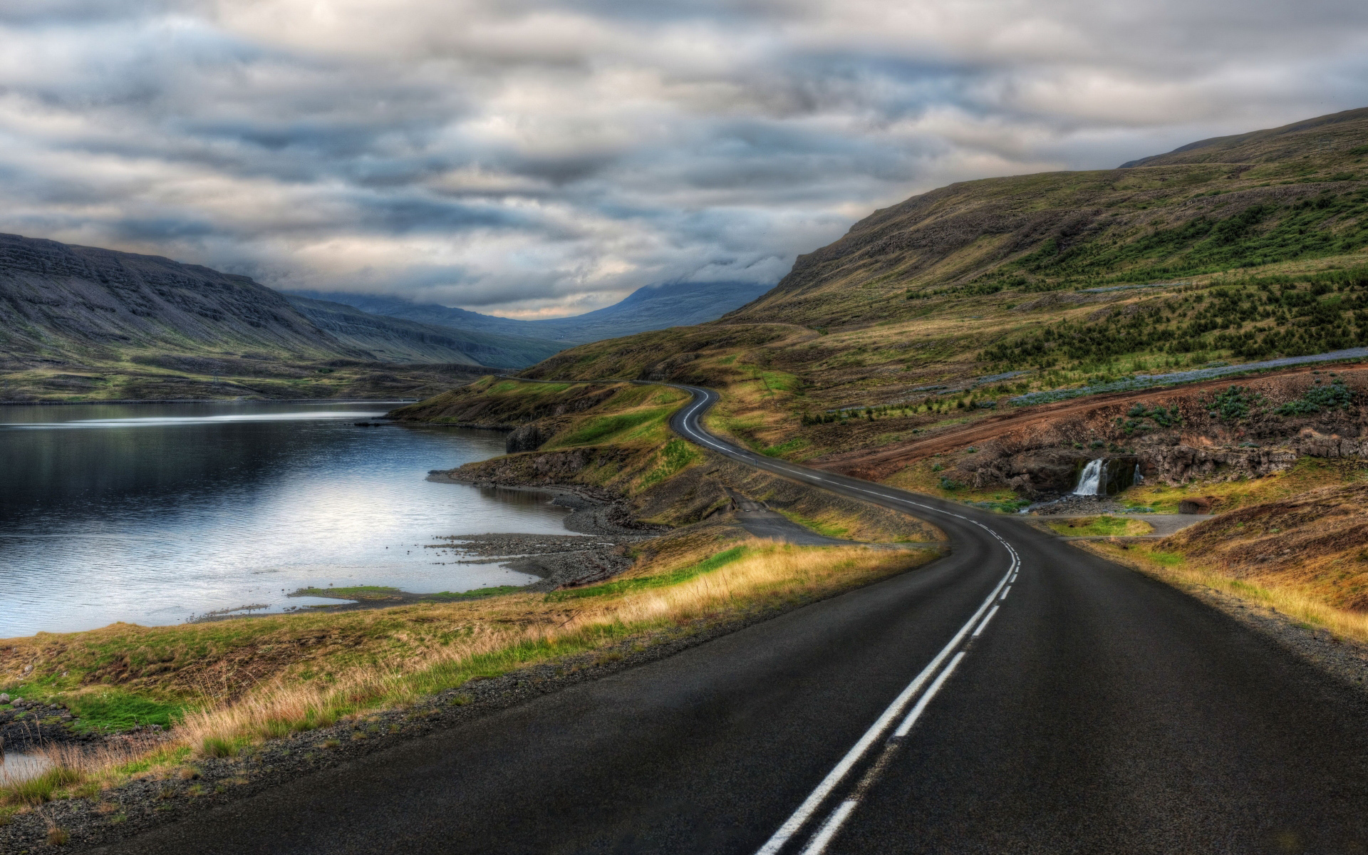 Download Wallpaper lake clouds road highway, 1920x Long and winding road along the lake