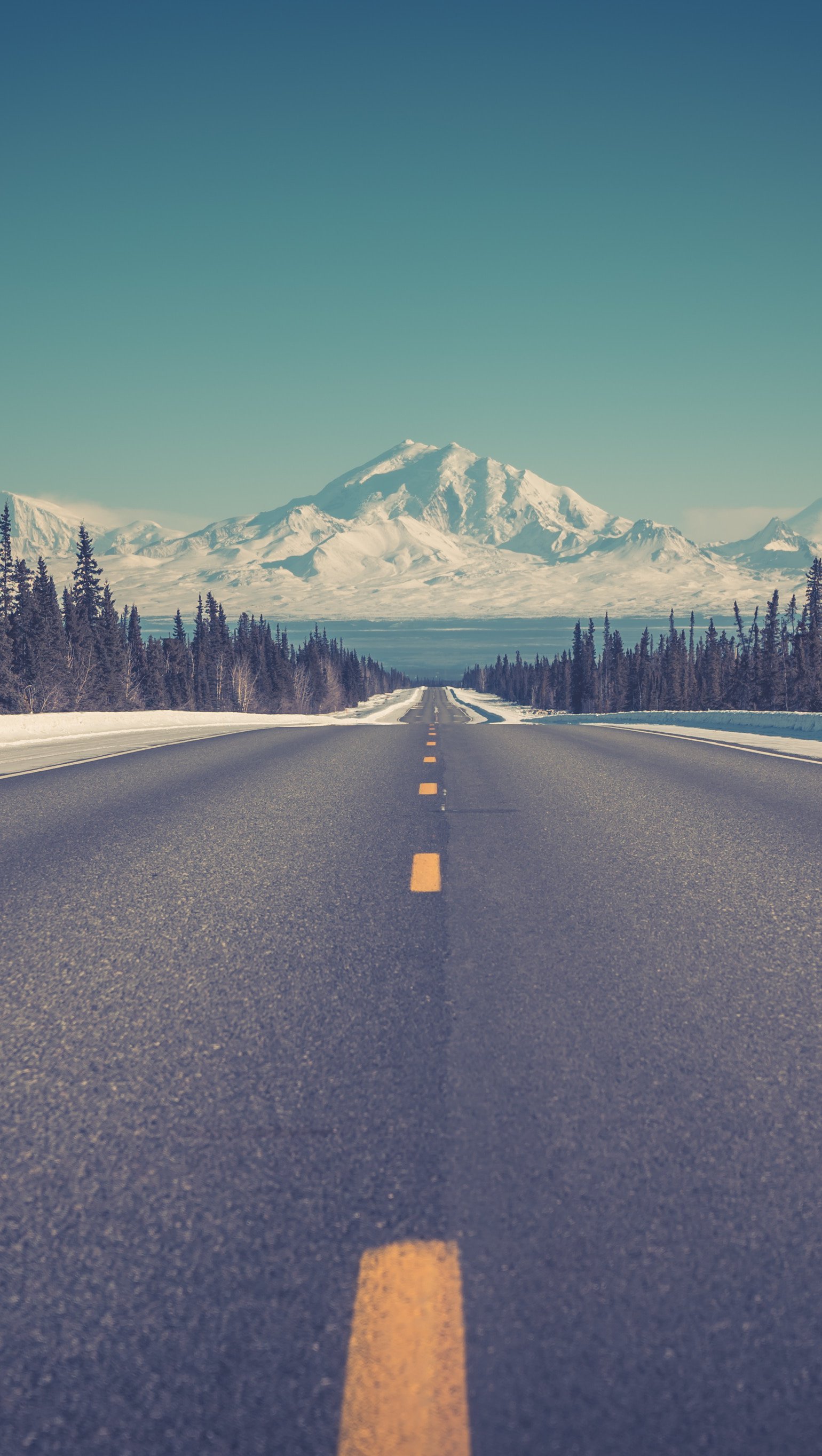 Road to mountains in winter Wallpaper