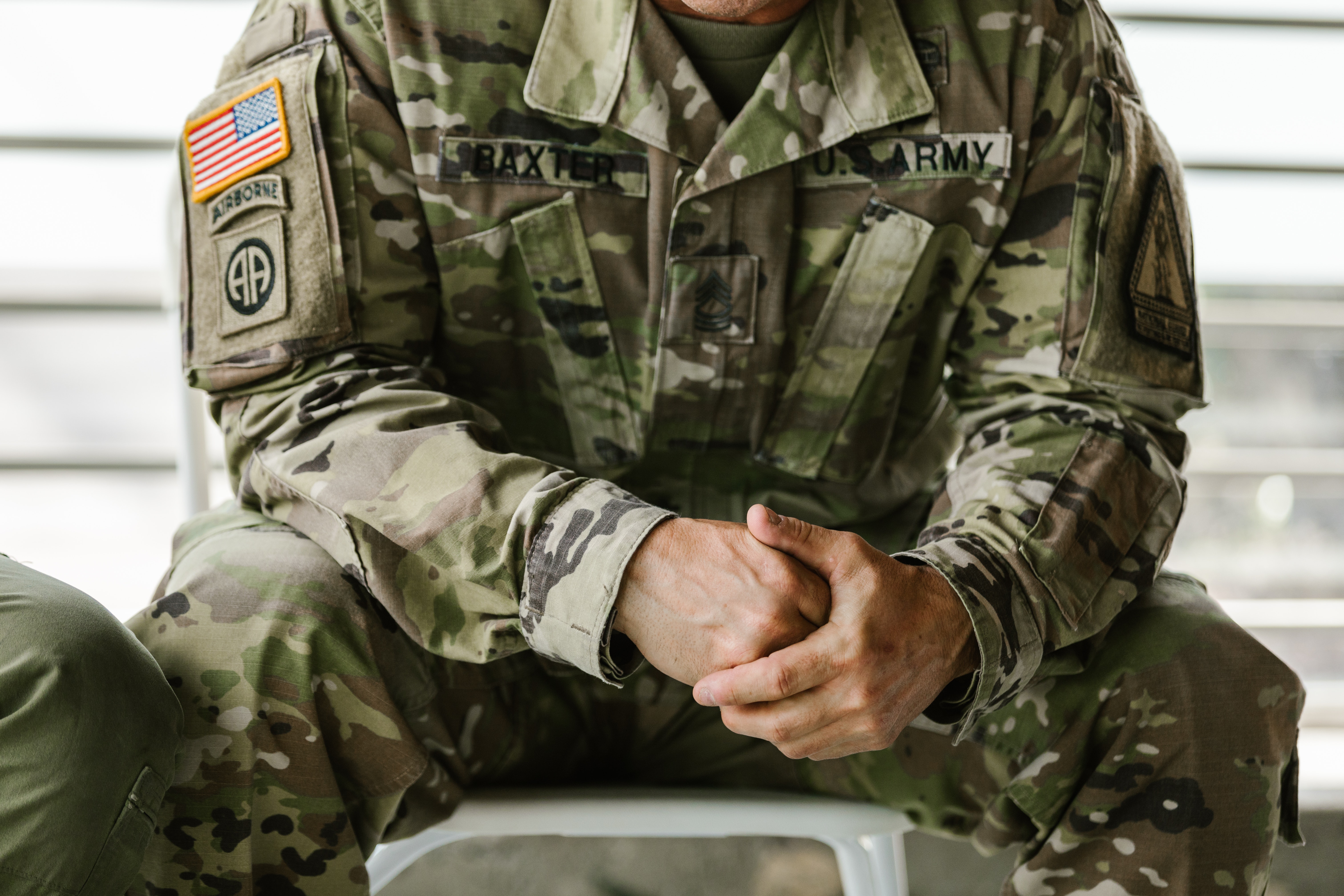 Photo of Military Uniform Hanging on a Rack · Free