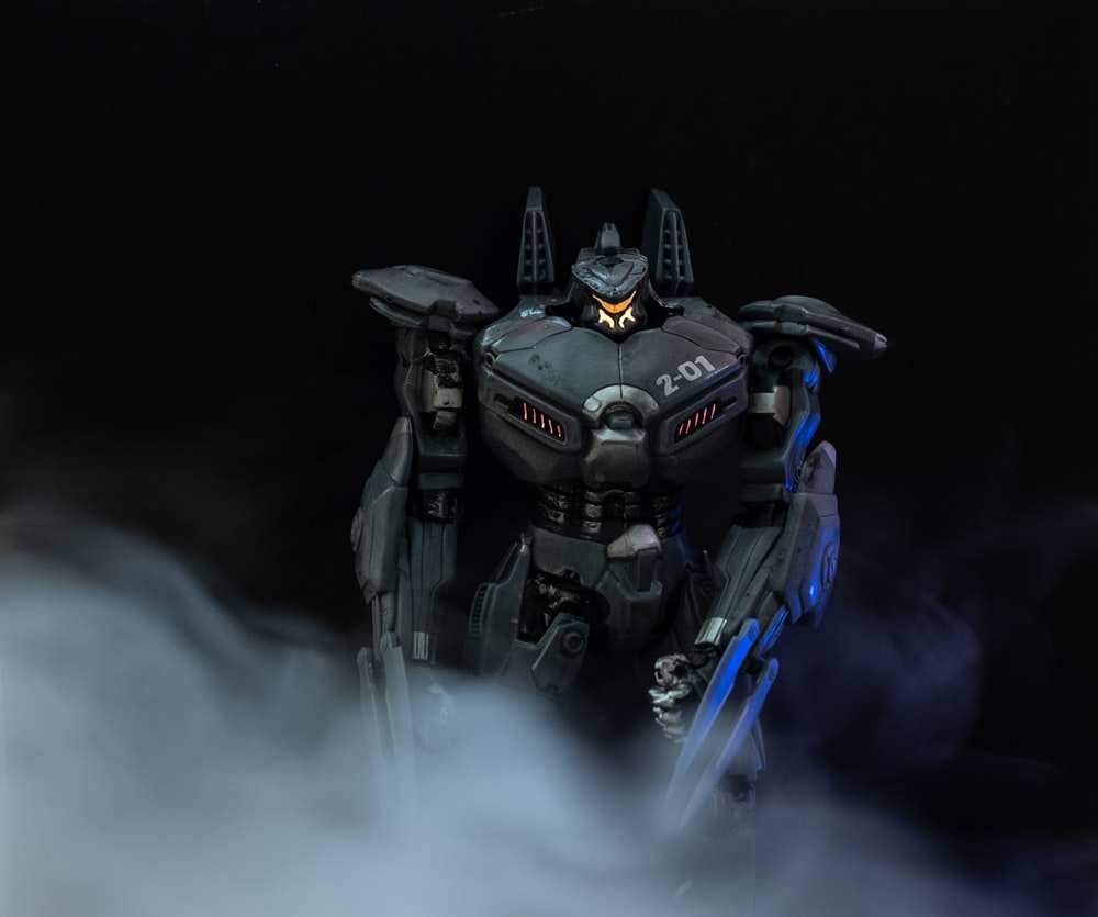 black and blue robot with blue and black smoke photo